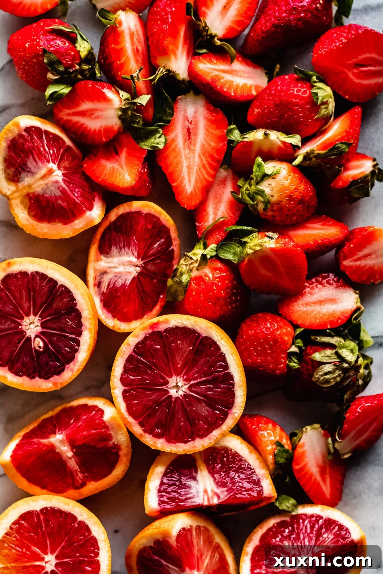 Fresh blood oranges and ripe strawberries, key ingredients for an immune-boosting smoothie