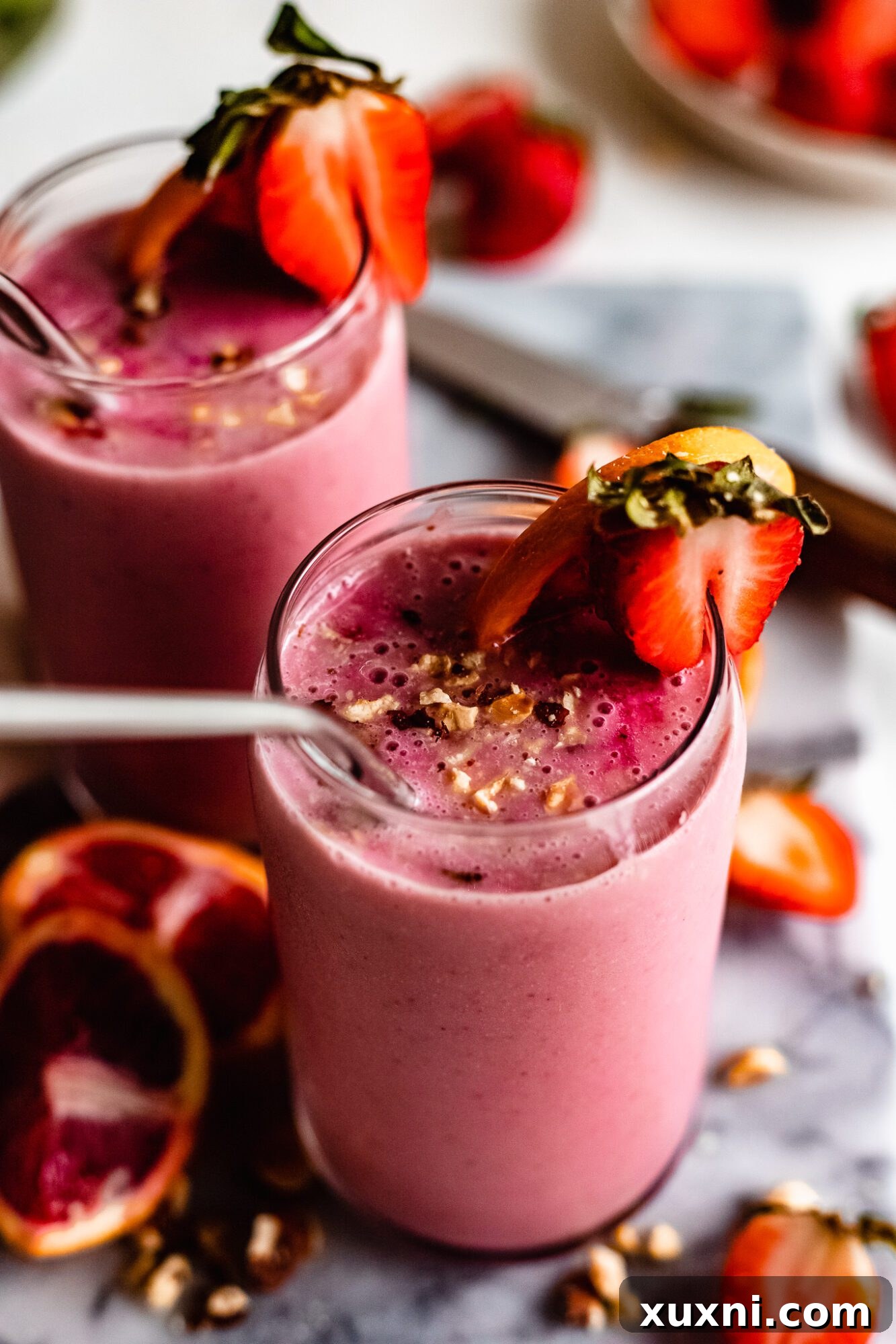 Two glasses of Immune Boosting Strawberry Orange Smoothie ready to be enjoyed