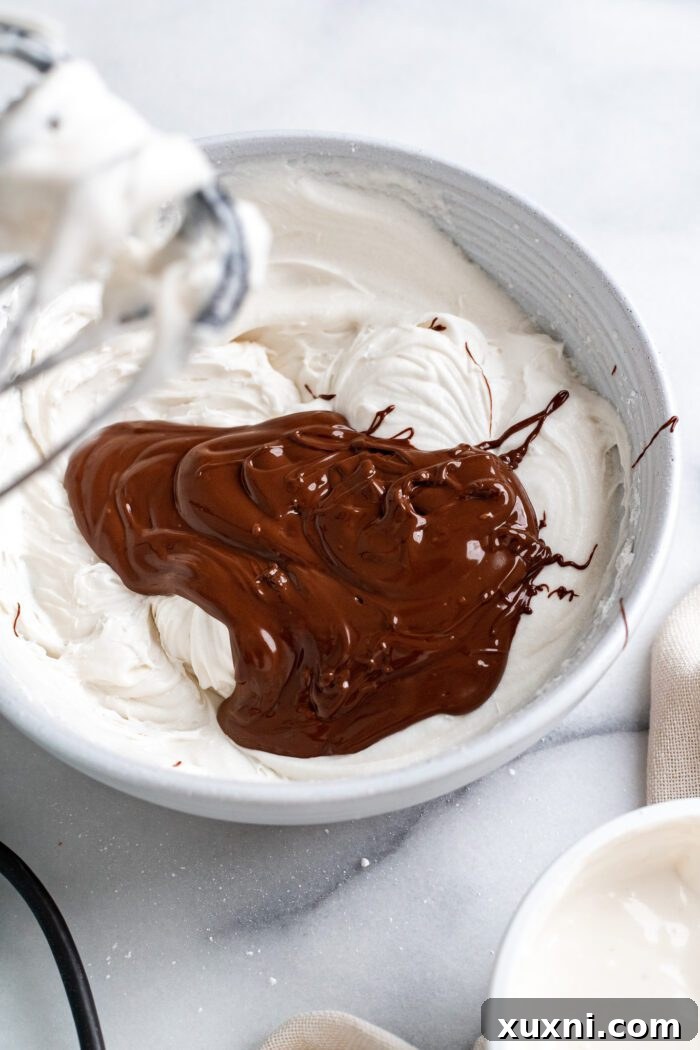 The initial step of making vegan chocolate sour cream buttercream, showing vegan butter and dairy-free sour cream being creamed together.