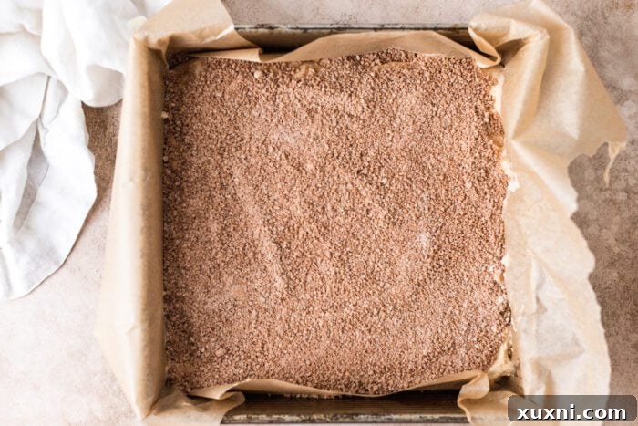 vegan coffee cake being assembled in a baking pan