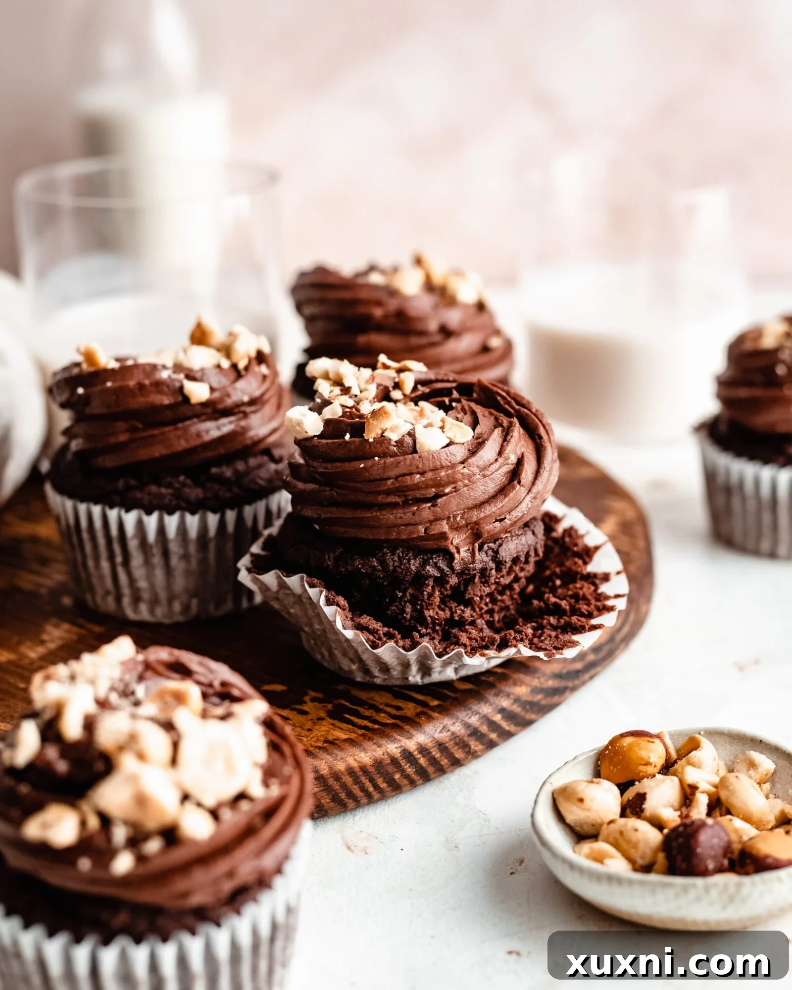 Close-up of a frosted vegan Nutella cupcake with hazelnuts