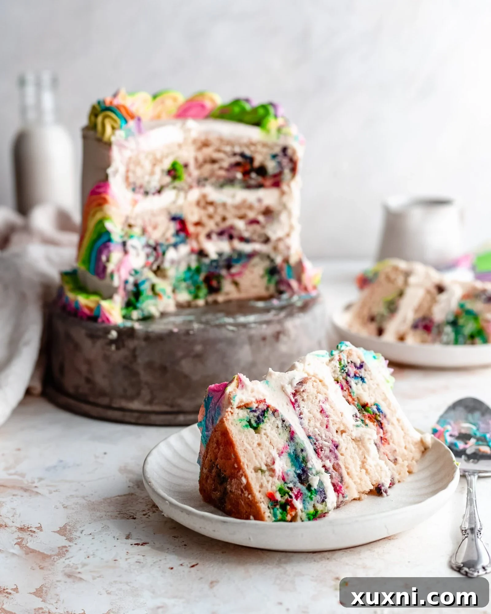 A perfect slice of rainbow swirl cake revealing its vibrant colors