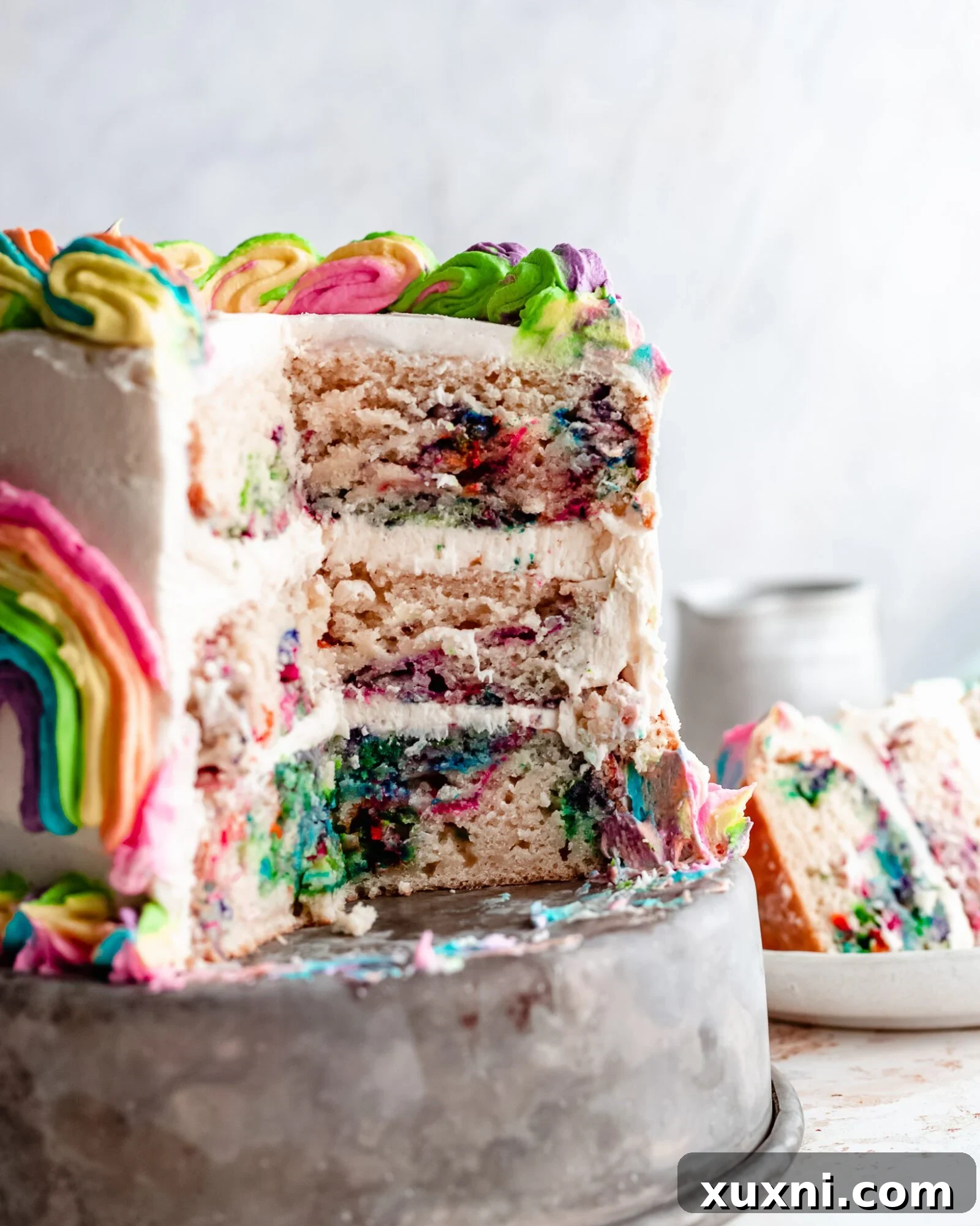 Close up view of the vibrant rainbow swirl cake