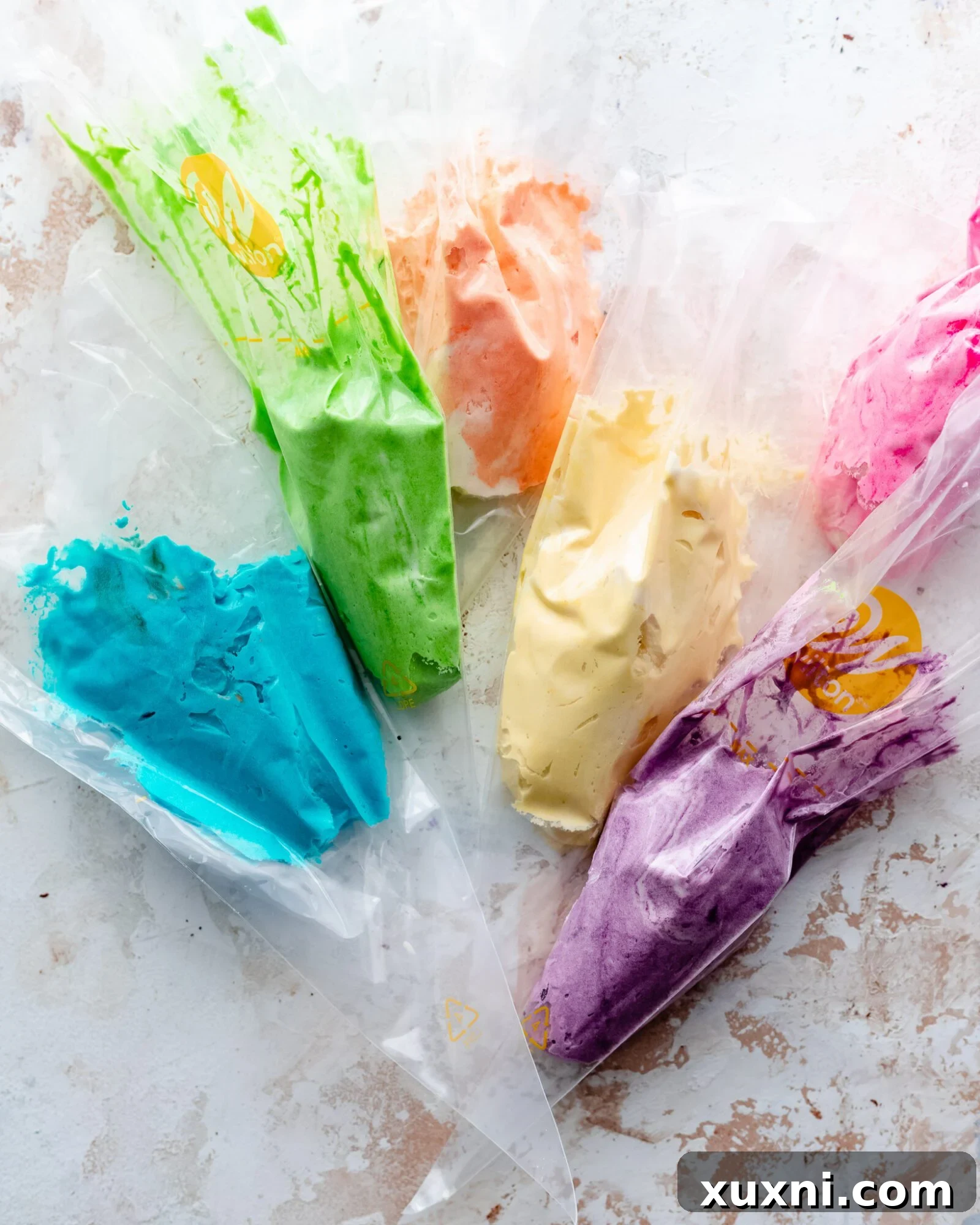 Vibrant rainbow colored vegan buttercream frosting