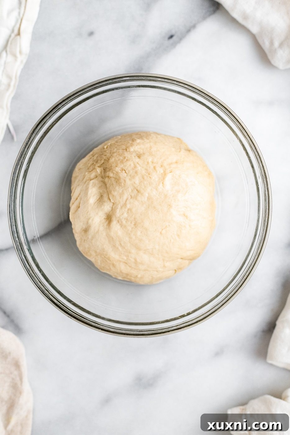 vegan dinner roll dough in bowl before first rise