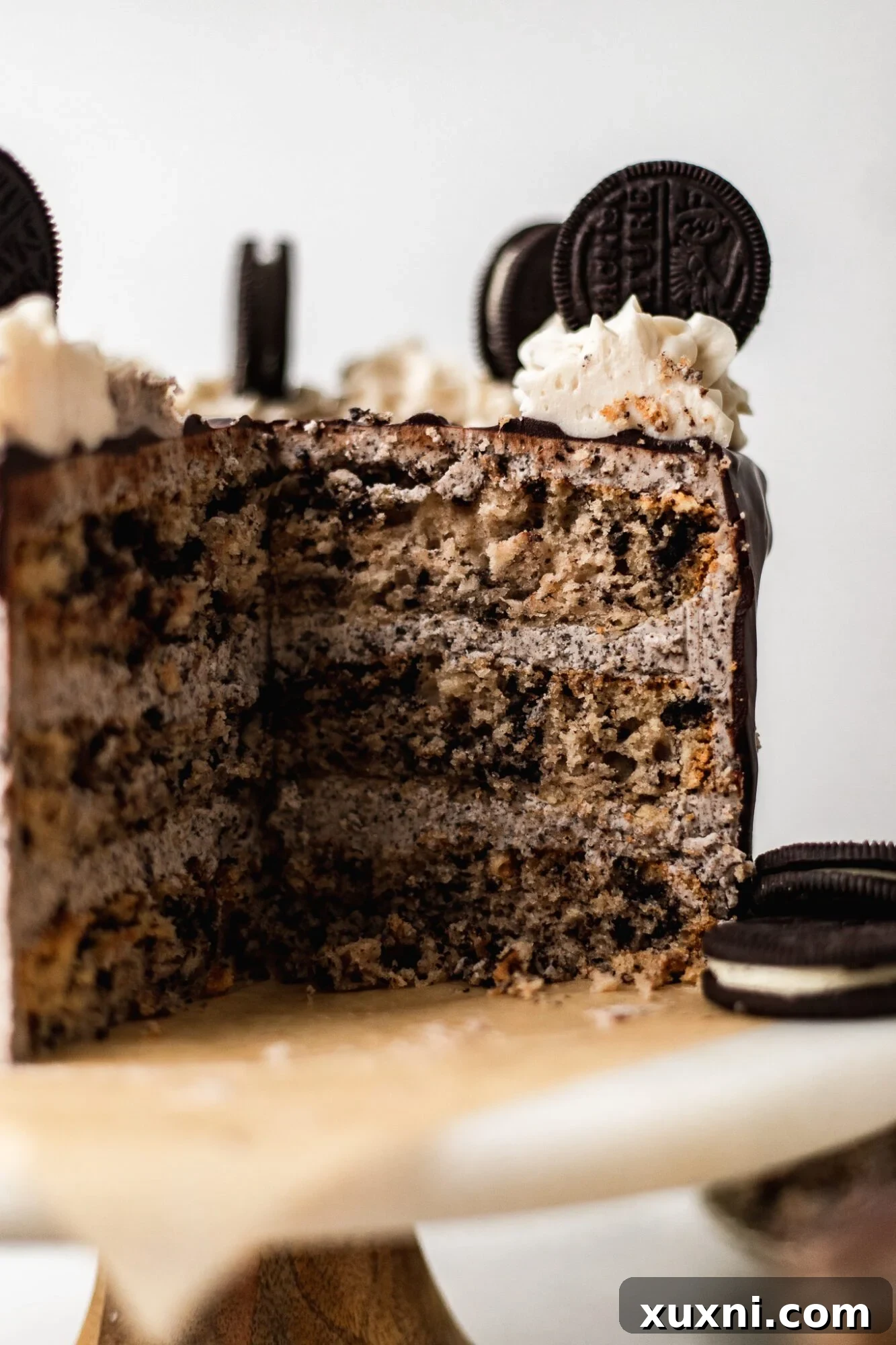 sliced cookies n cream cake on cake stand