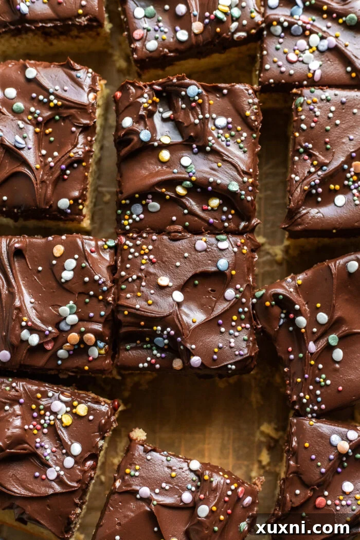 Multiple slices of vegan birthday cake on a serving platter