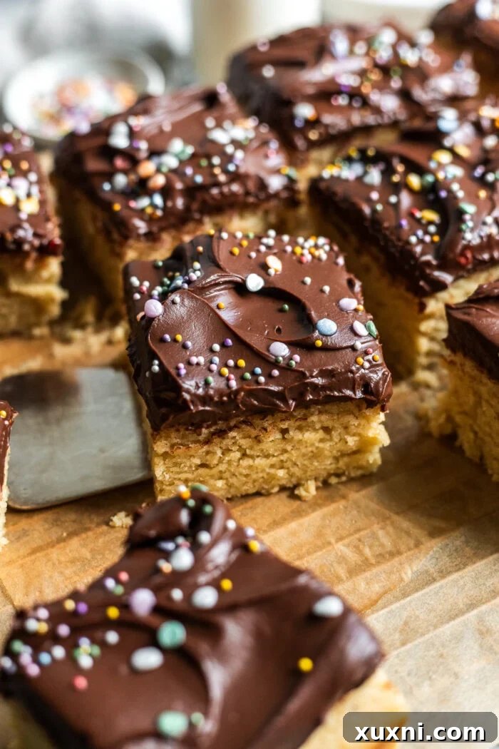 Slices of vegan birthday cake on a marble board