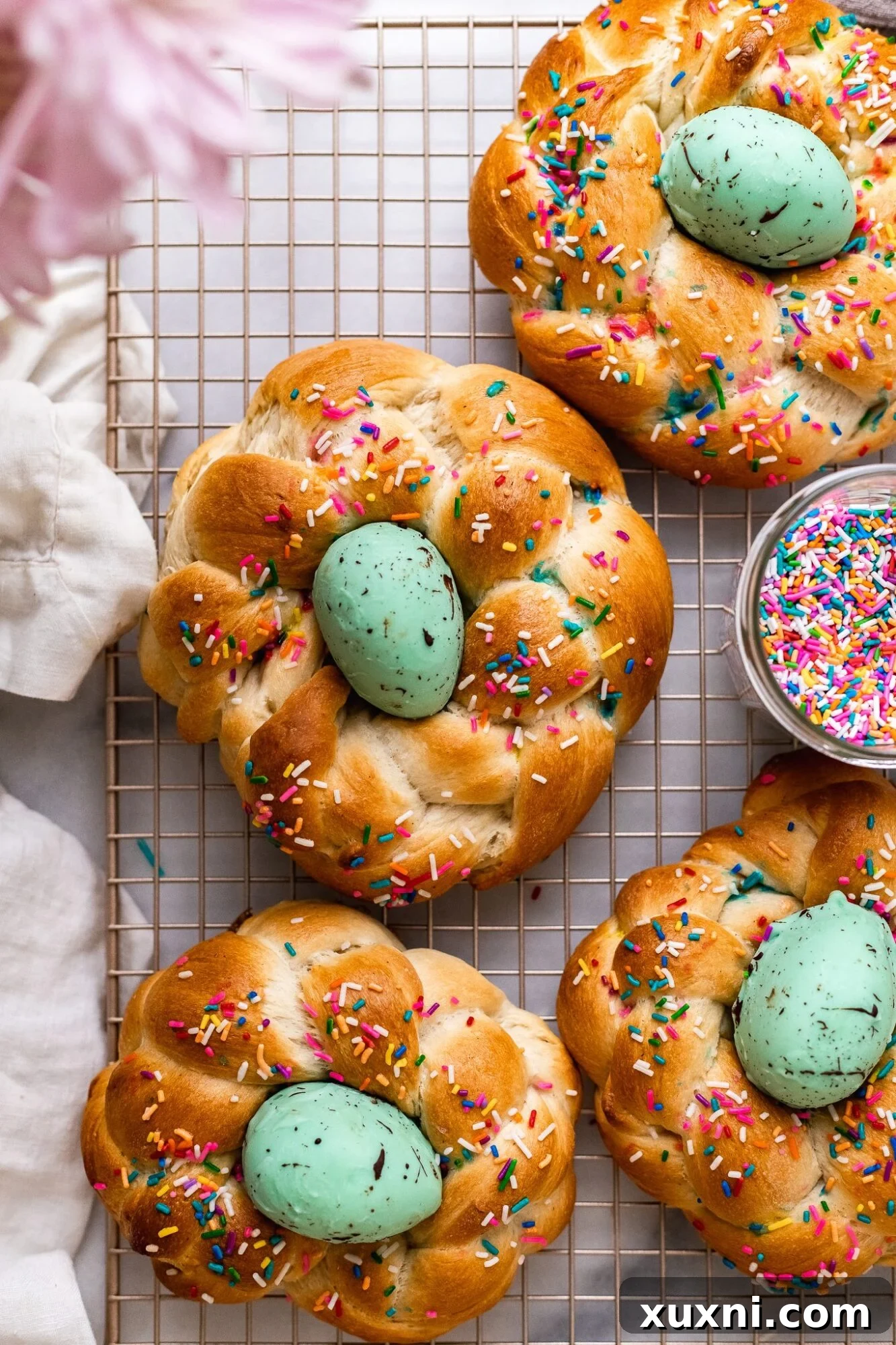 Vegan Italian Easter bread, golden brown and adorned, resting on a cooling rack, ready to be enjoyed.