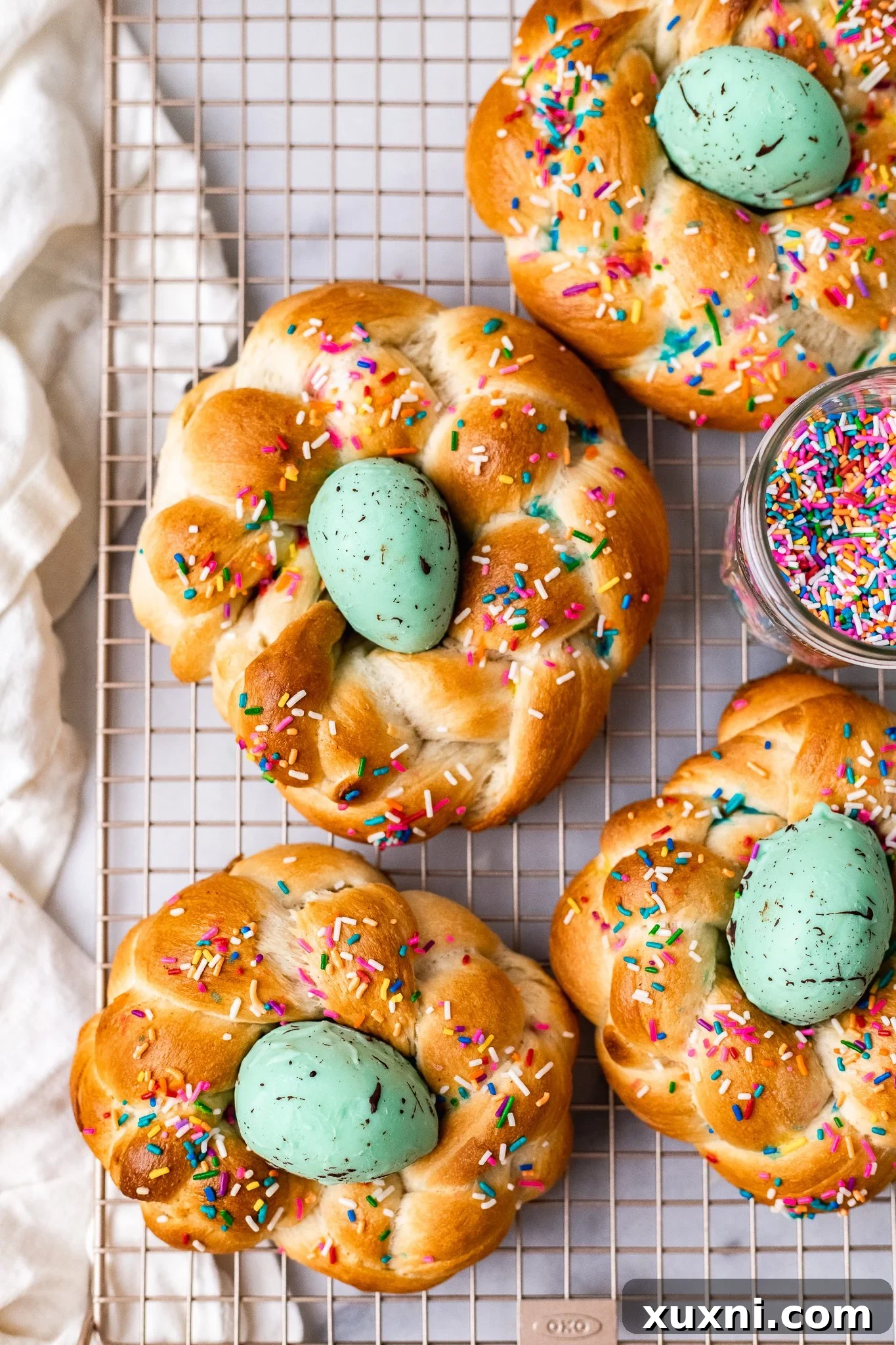 A finished vegan Italian Easter bread beautifully adorned with its homemade vegan white chocolate egg, creating a festive display.