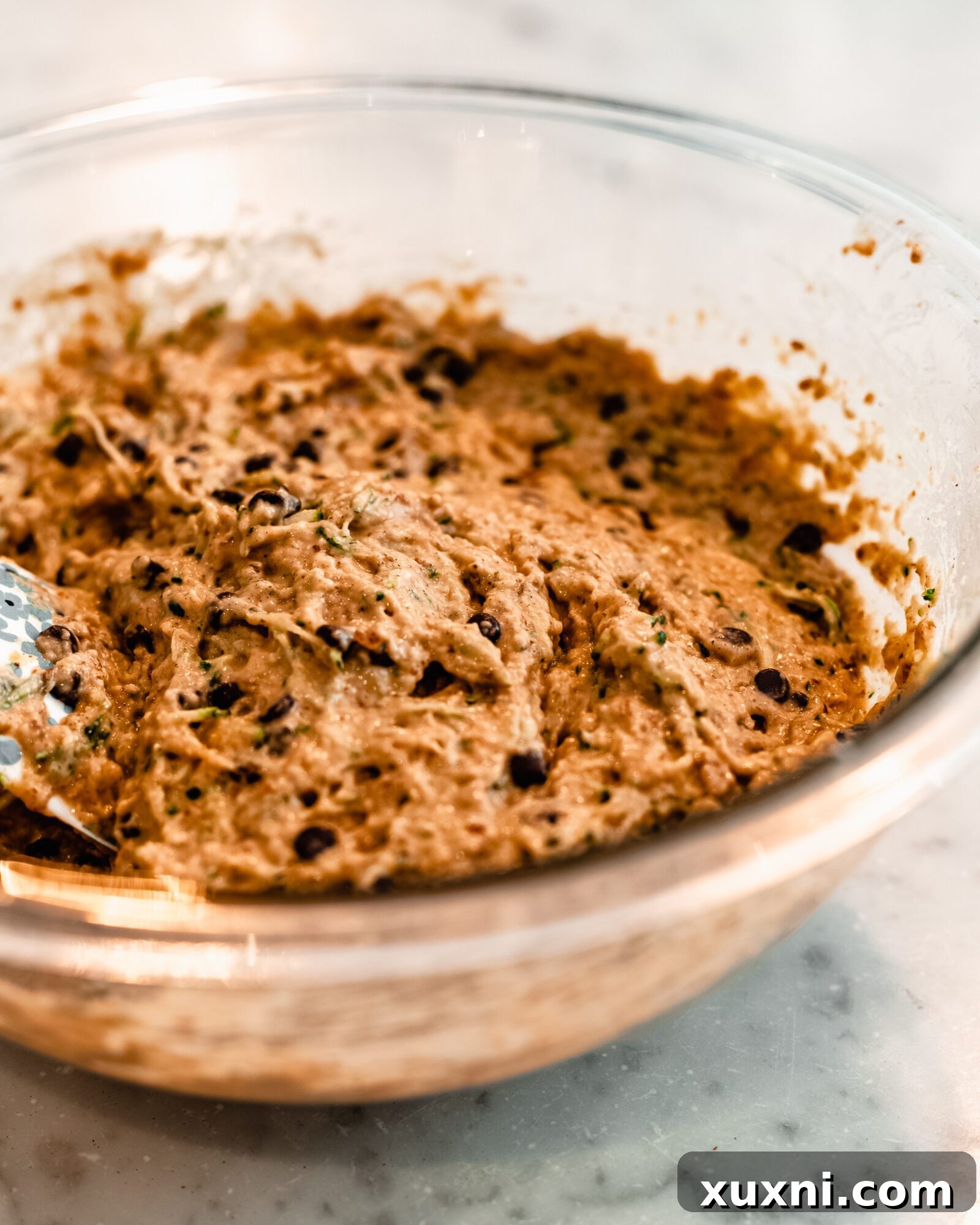 The fluffy vegan zucchini muffin batter, showing its readiness for baking.