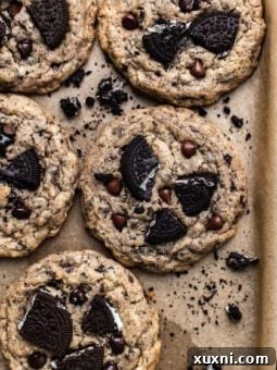 Delicious vegan gluten-free Oreo chocolate chip cookies on a baking sheet, ready to be enjoyed.