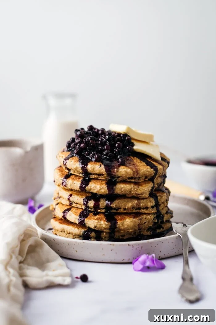stack of fluffy vegan oat flour pancakes