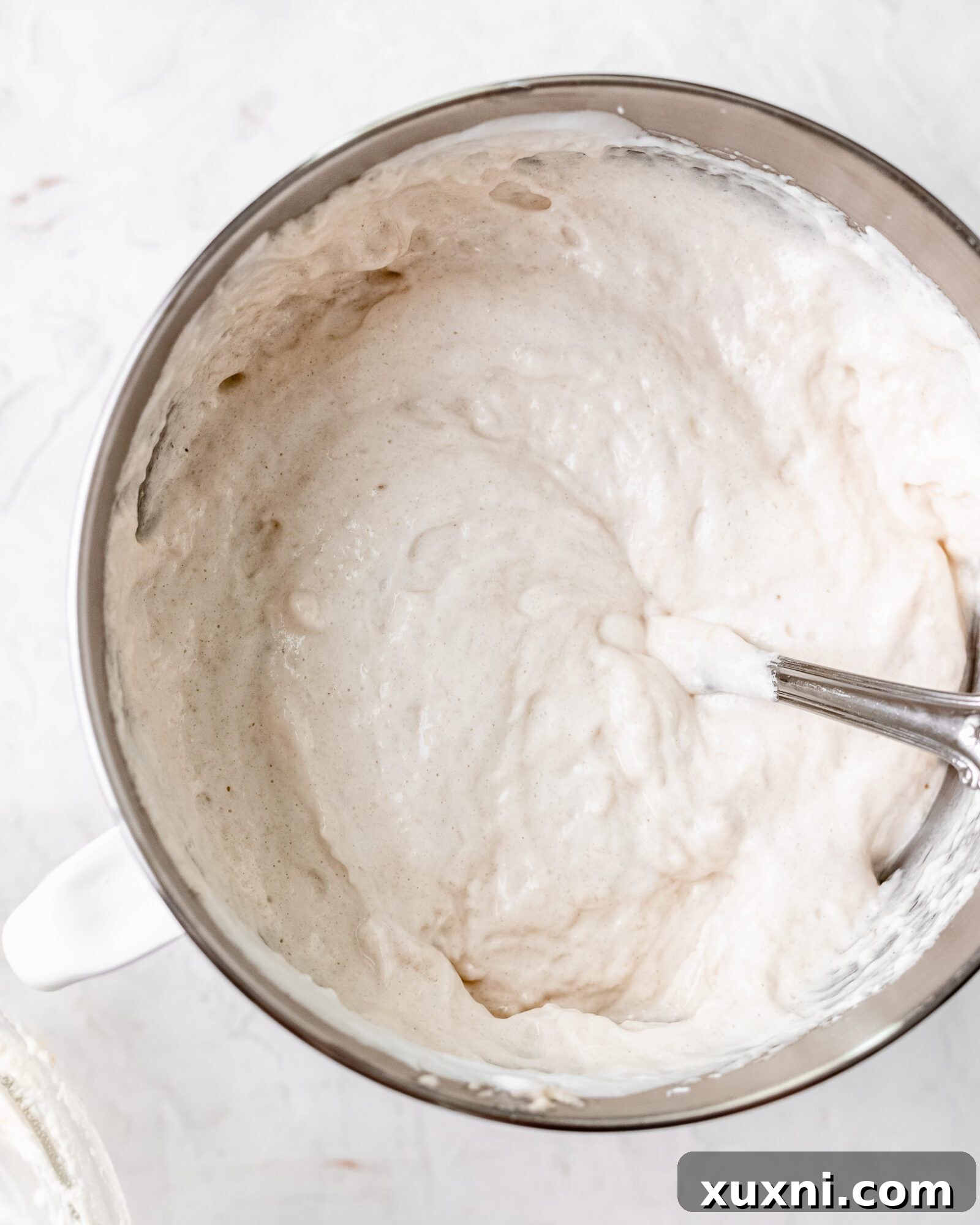 Homogenously mixed vegan chiffon cake batter, light and airy, ready for baking.