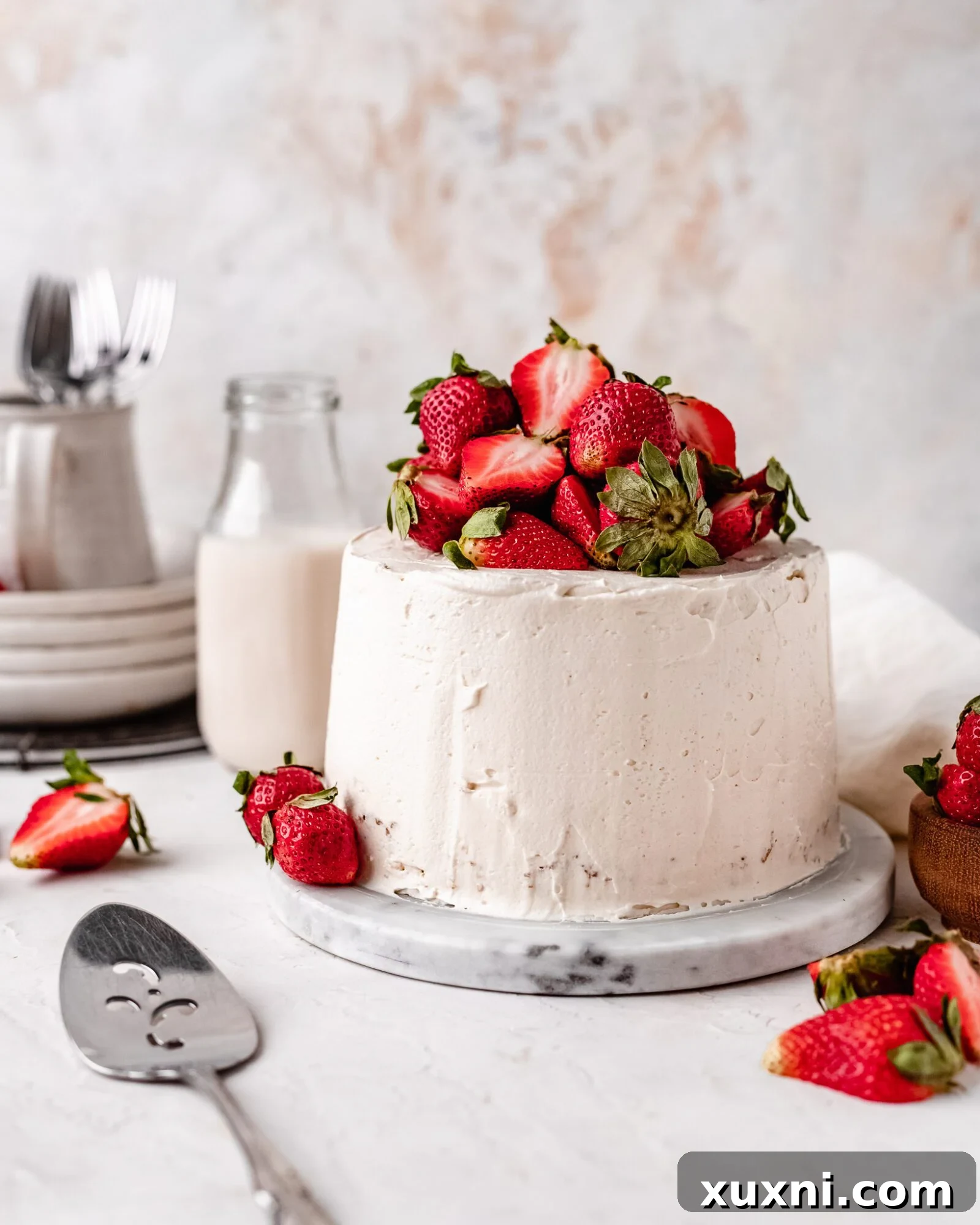 Close-up of fluffy, glossy vegan Swiss meringue buttercream in a mixing bowl, ready for frosting.
