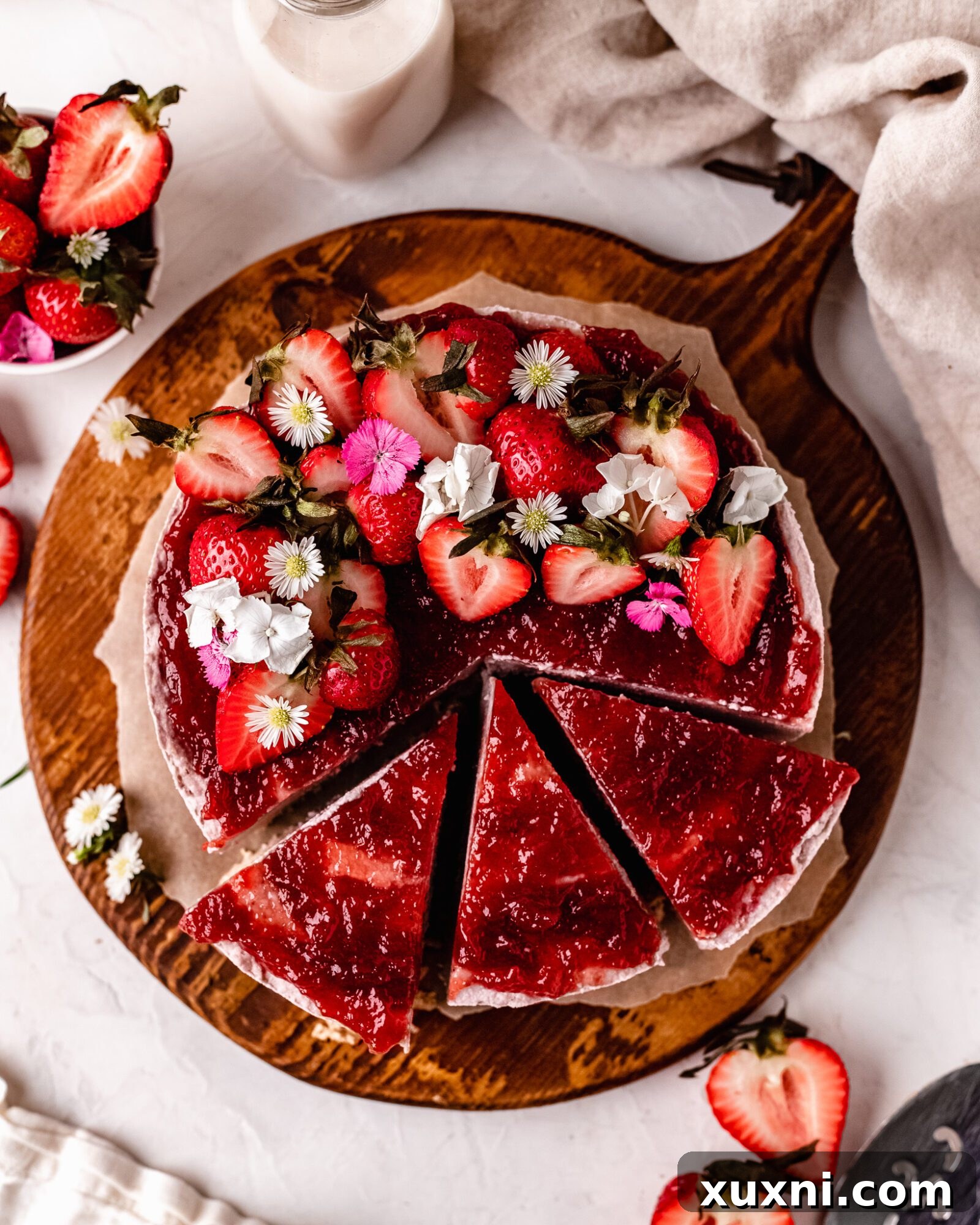 An overhead shot of a luscious vegan strawberry cheesecake slice