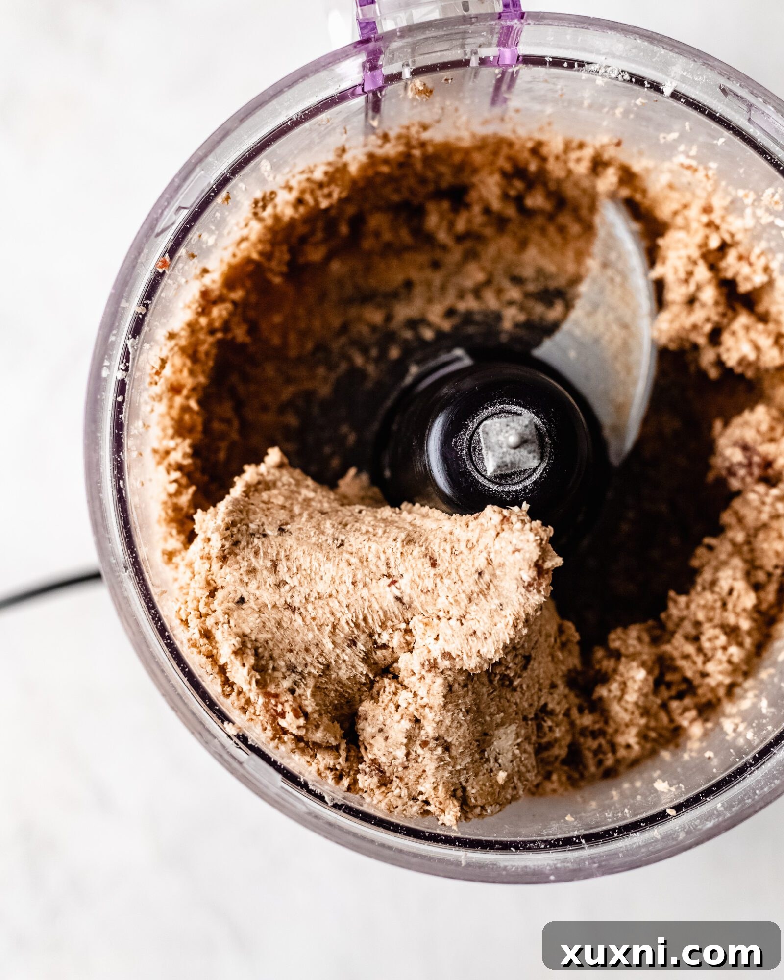 Close-up of oats, dates, and vegan butter ready for crust preparation