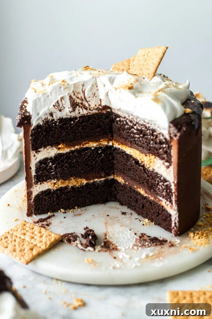 Toasted vegan marshmallow meringue artfully piped onto a cake