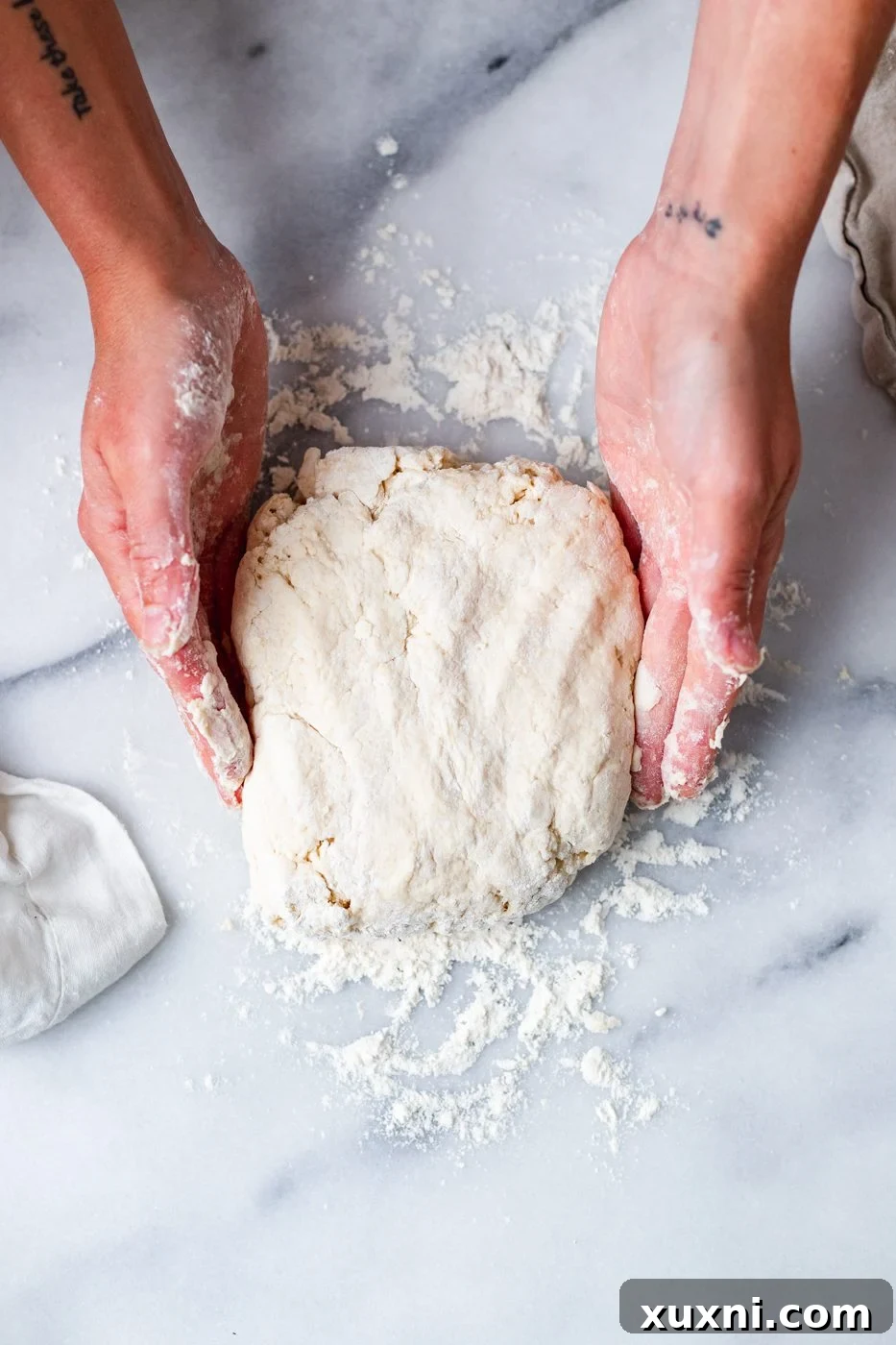 vegan biscuit dough on a marble surface