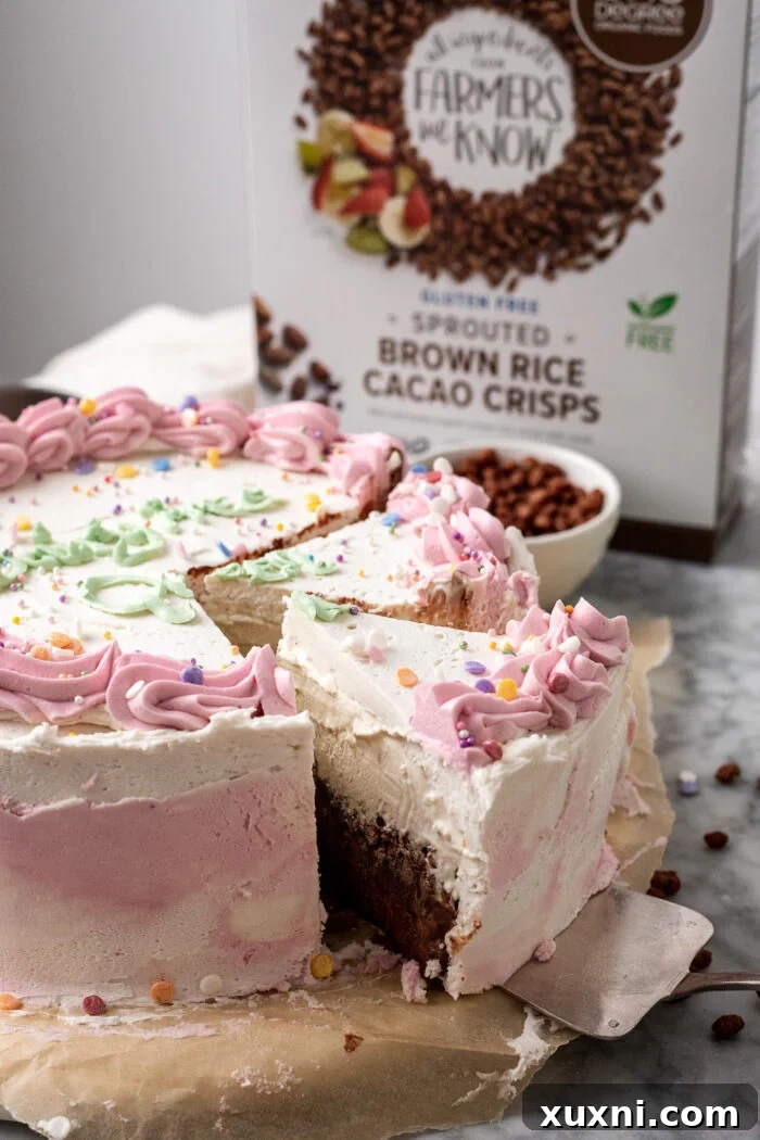Effortless Plant-Based Gluten-Free Ice Cream Cake 3 A stunning full view of a sliced homemade vegan ice cream cake, elegantly presented on a cake stand, revealing its beautiful layers and inviting texture.