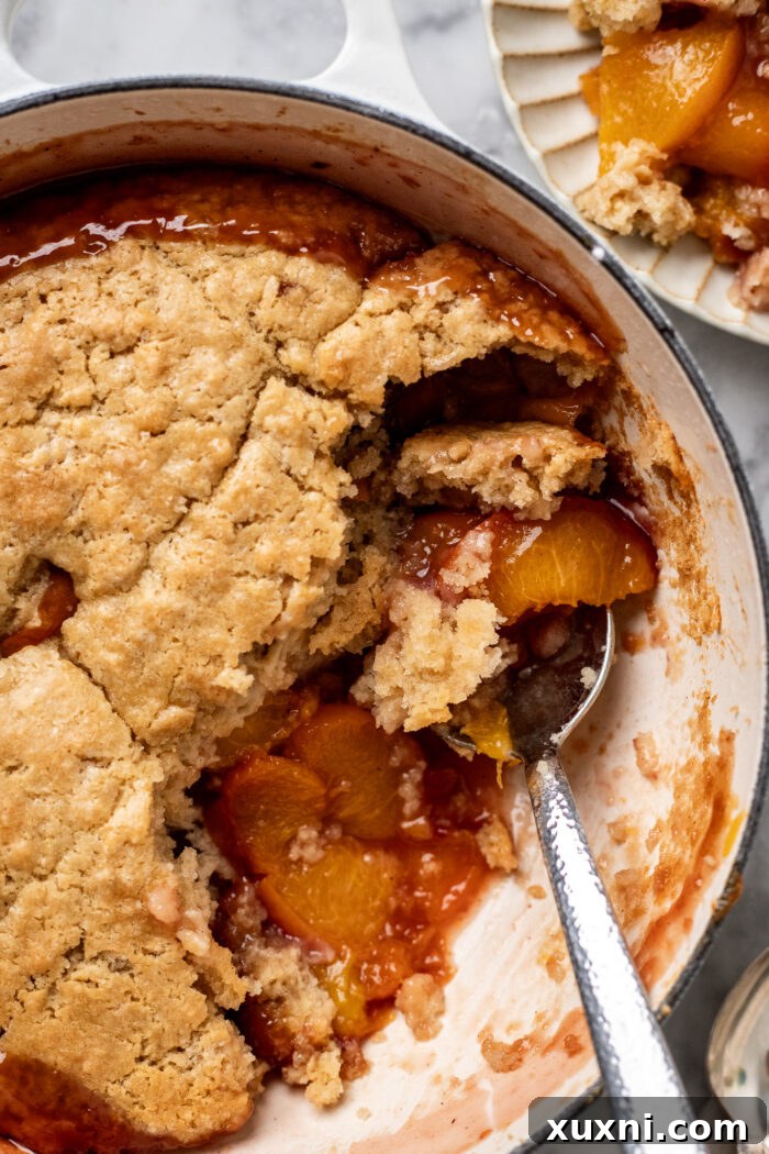 roasted peach cobbler in a baking dish