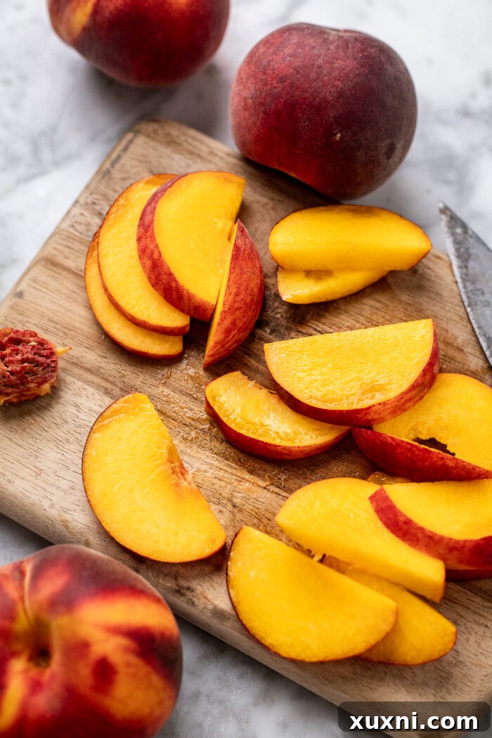 sliced peaches on a cutting board