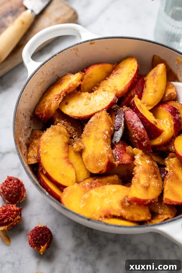 casserole dish with peach slices mixed in