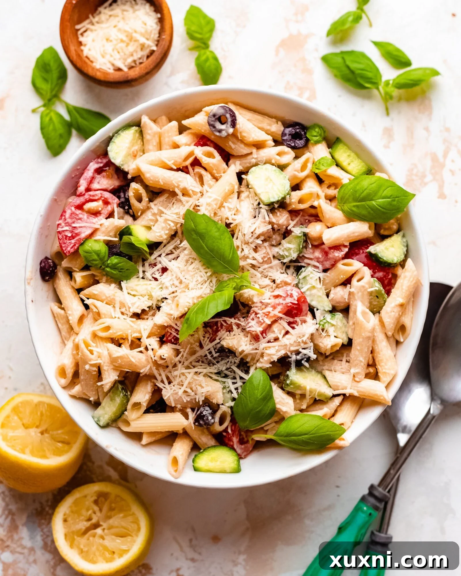 Easy + Healthy Vegan Pasta Salad (Gluten Free!) - A vibrant bowl of creamy vegan pasta salad with fresh vegetables and a zesty lemon tahini dressing, perfect for summer gatherings.