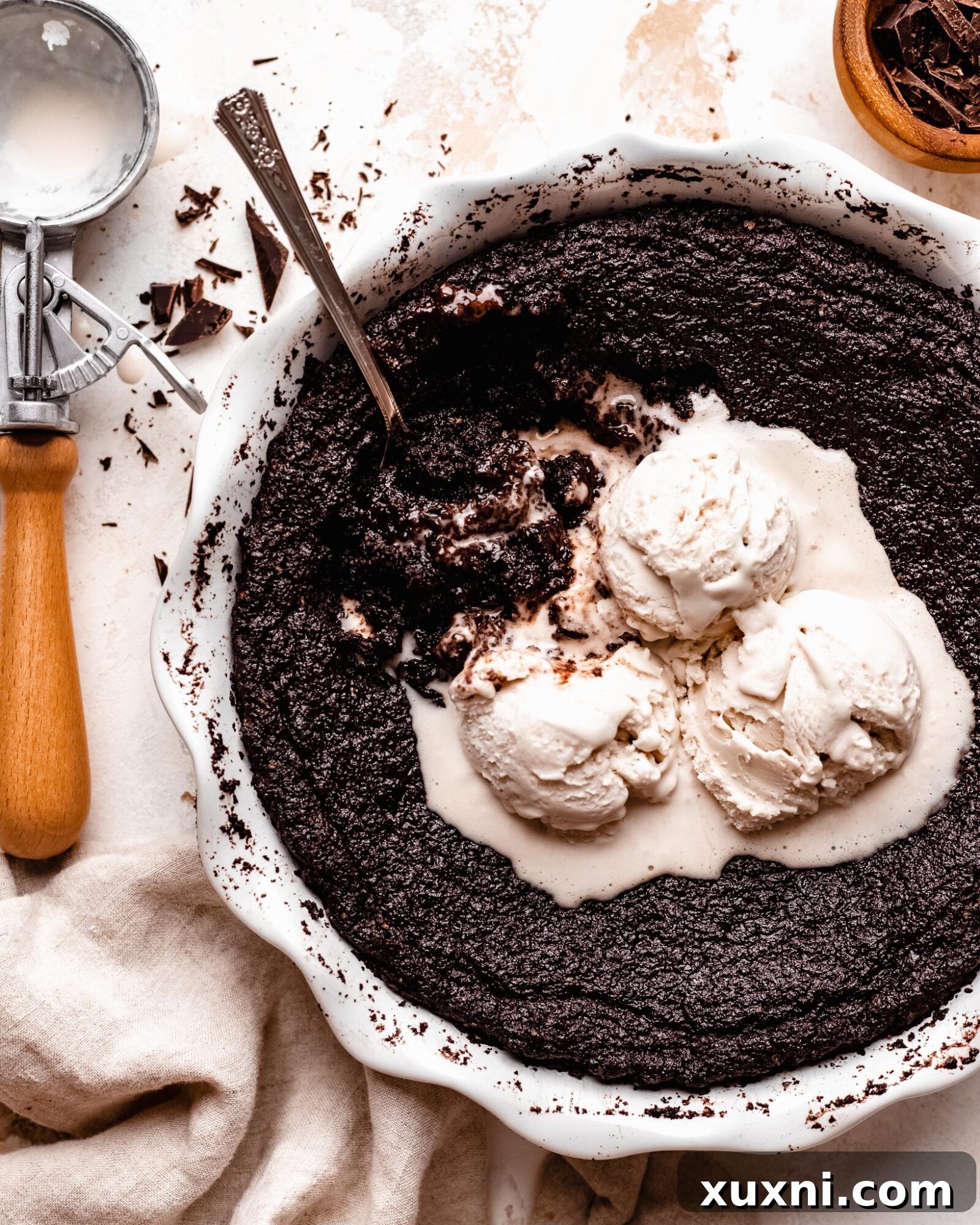 Best Ever Easy Skillet Brownie (Vegan + Gluten Free) - a perfectly baked, gooey brownie in a cast iron skillet, ready to be served.