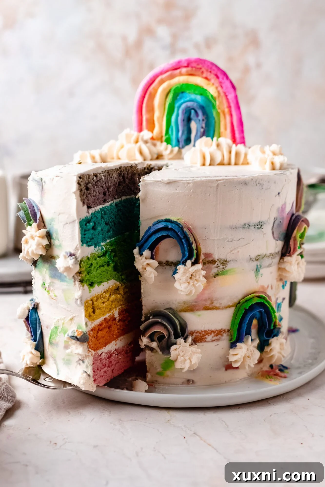 sliced vegan rainbow cake