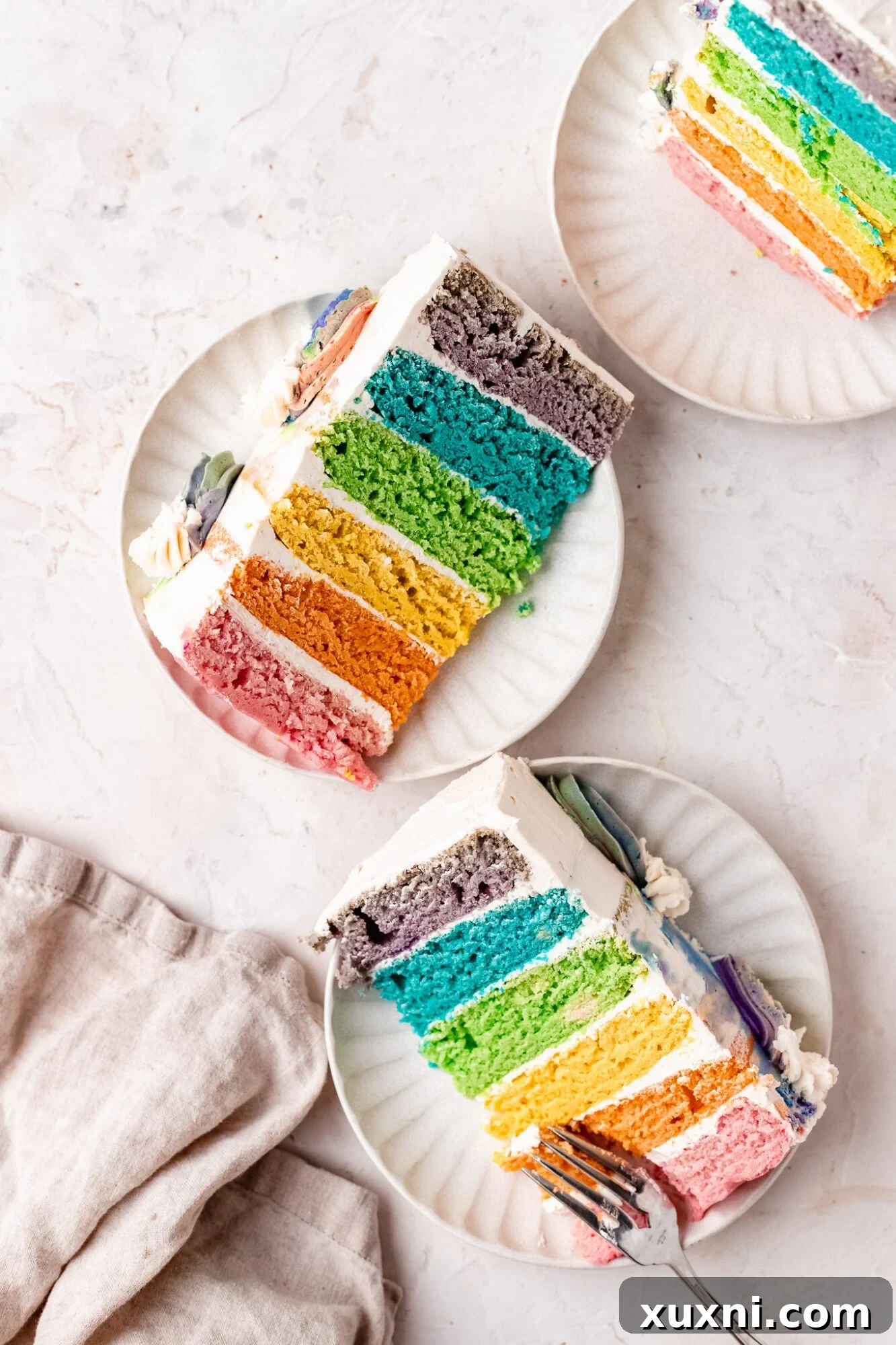 slice of rainbow birthday cake