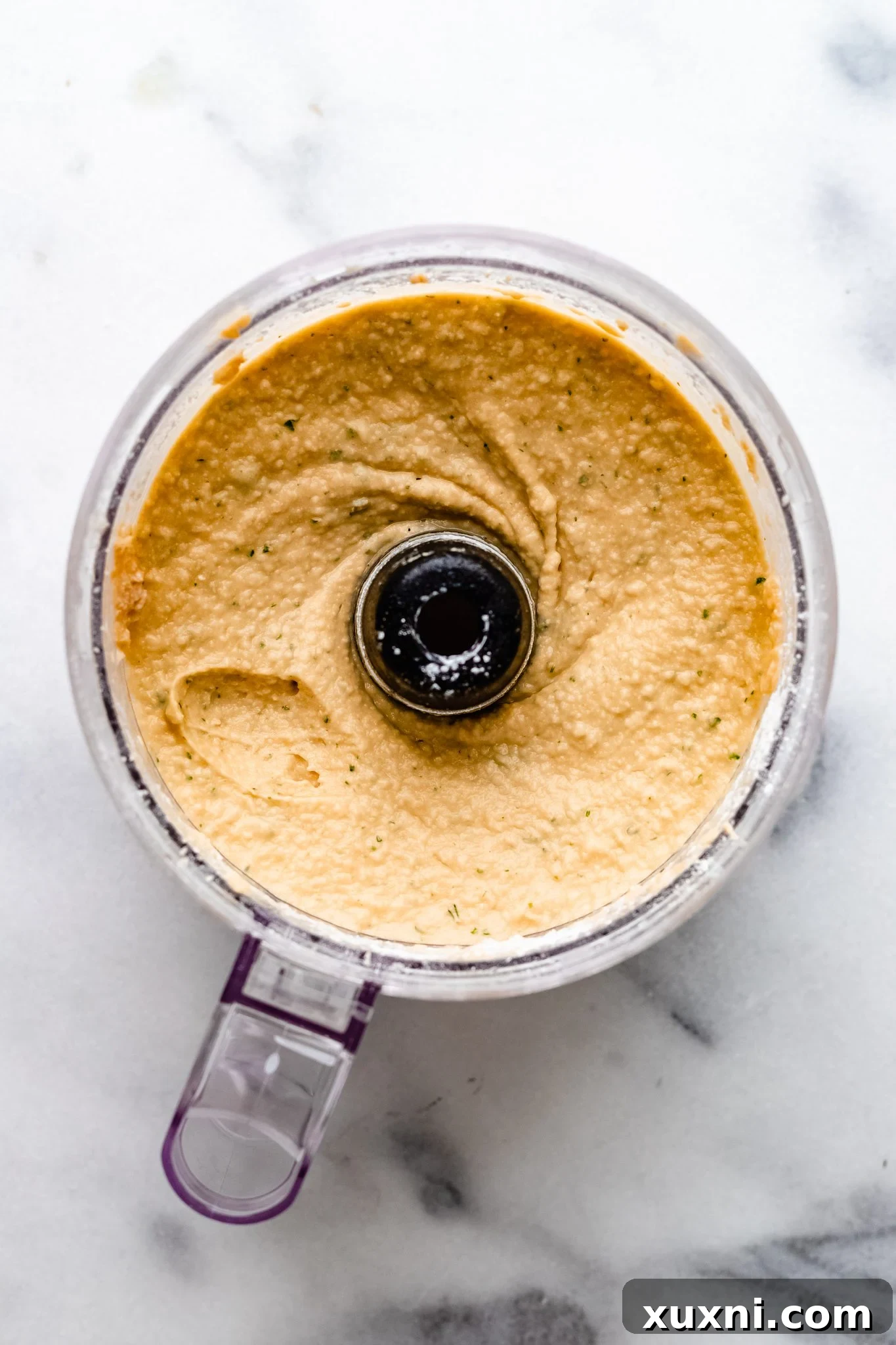 pureed vegan quiche filling in a food processor