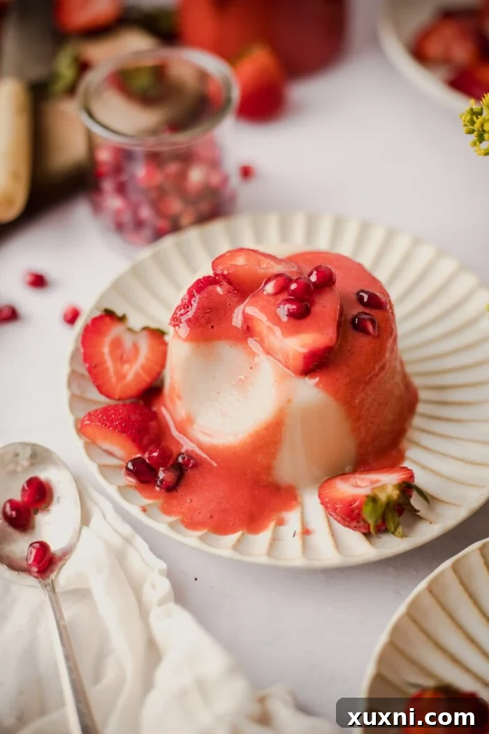 plate of vegan Panna cotta with strawberry coulis