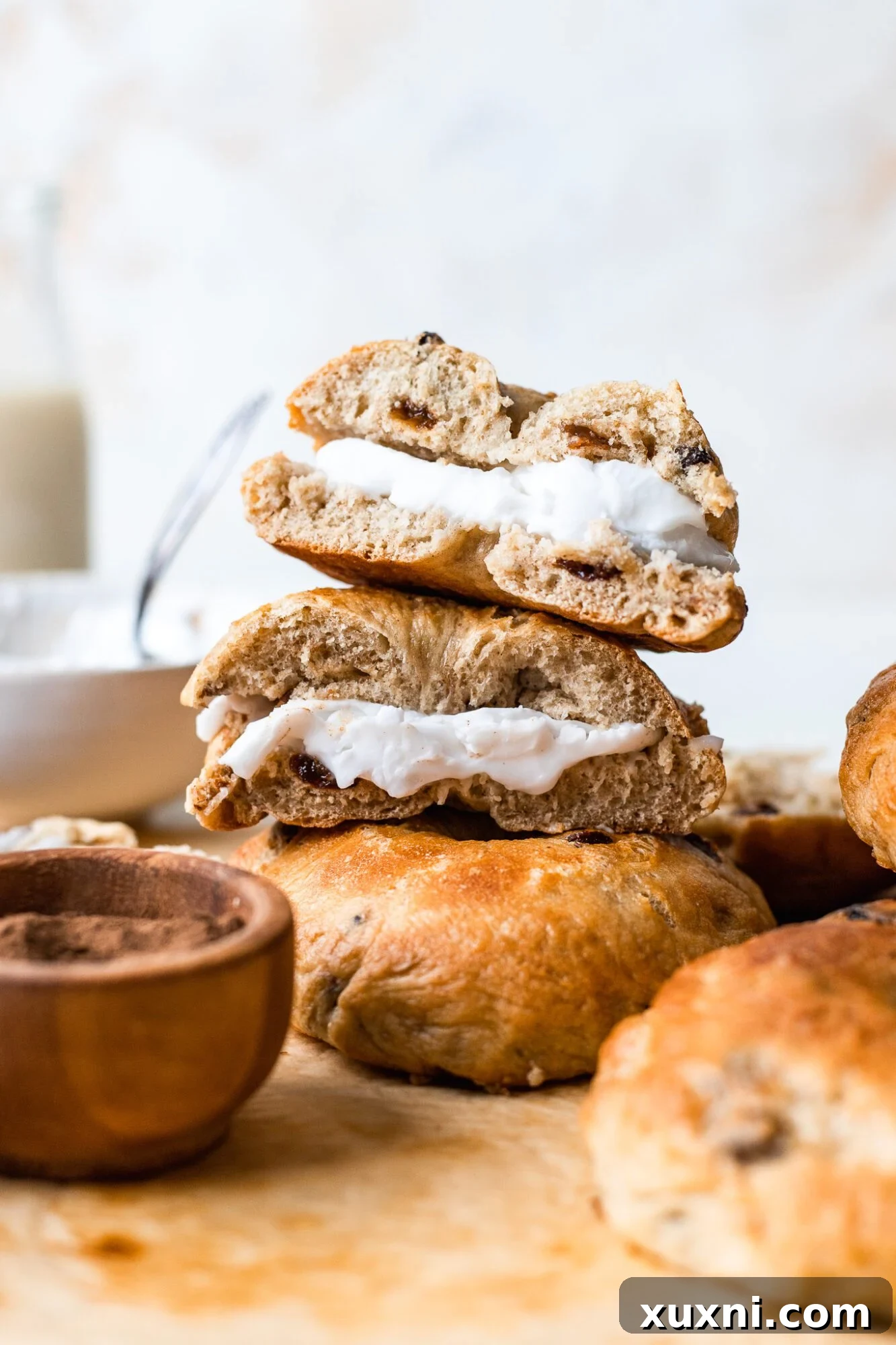 Effortless Homemade Vegan Cinnamon Raisin Bagels 4 stacked sliced vegan cinnamon raisin bagels