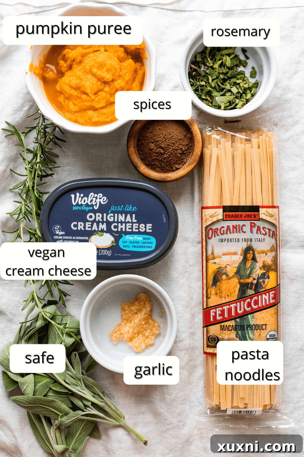 various ingredients for vegan pumpkin pasta laid out on a table