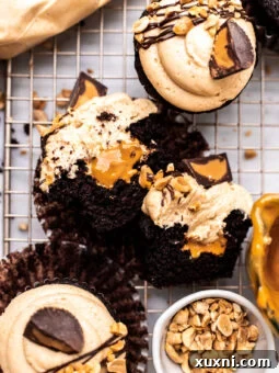 sliced open vegan chocolate peanut butter cupcakes