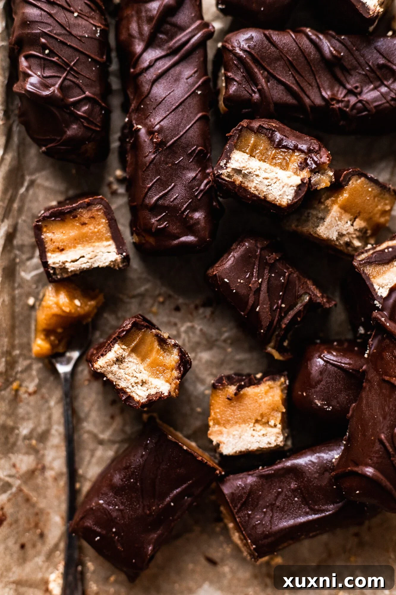 Perfectly sliced homemade vegan Twix bars showcasing the distinct layers.
