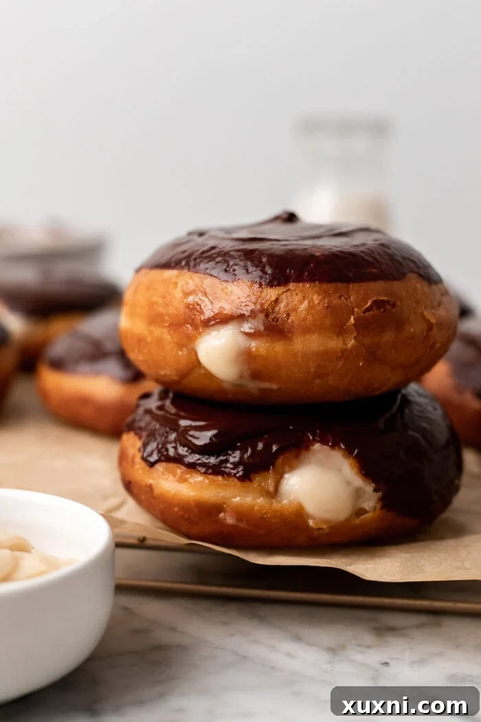 Decadent and Easy Vegan Boston Cream Doughnuts 3 stack of vegan Boston cream doughnuts