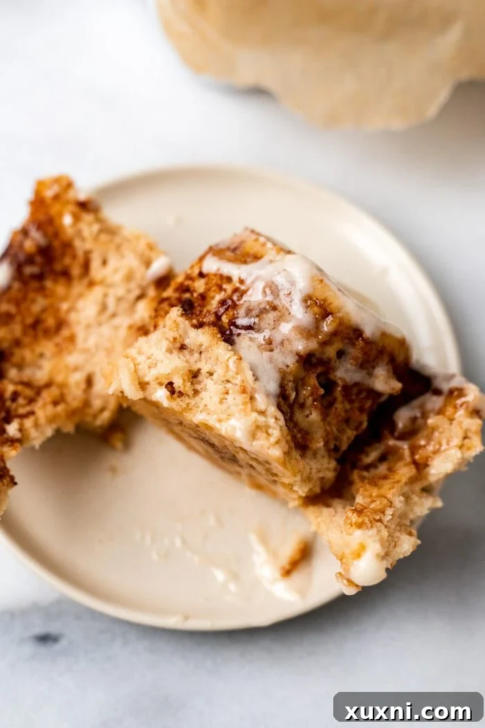 gluten free cinnamon roll unrolled on a plate