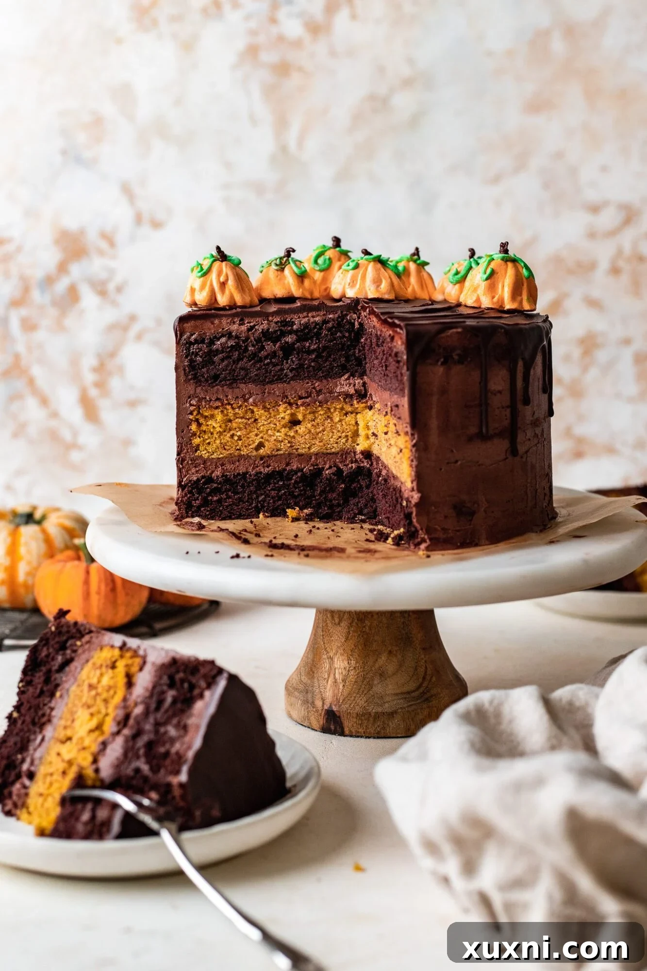 Decadent slice of vegan chocolate pumpkin cake with frosting