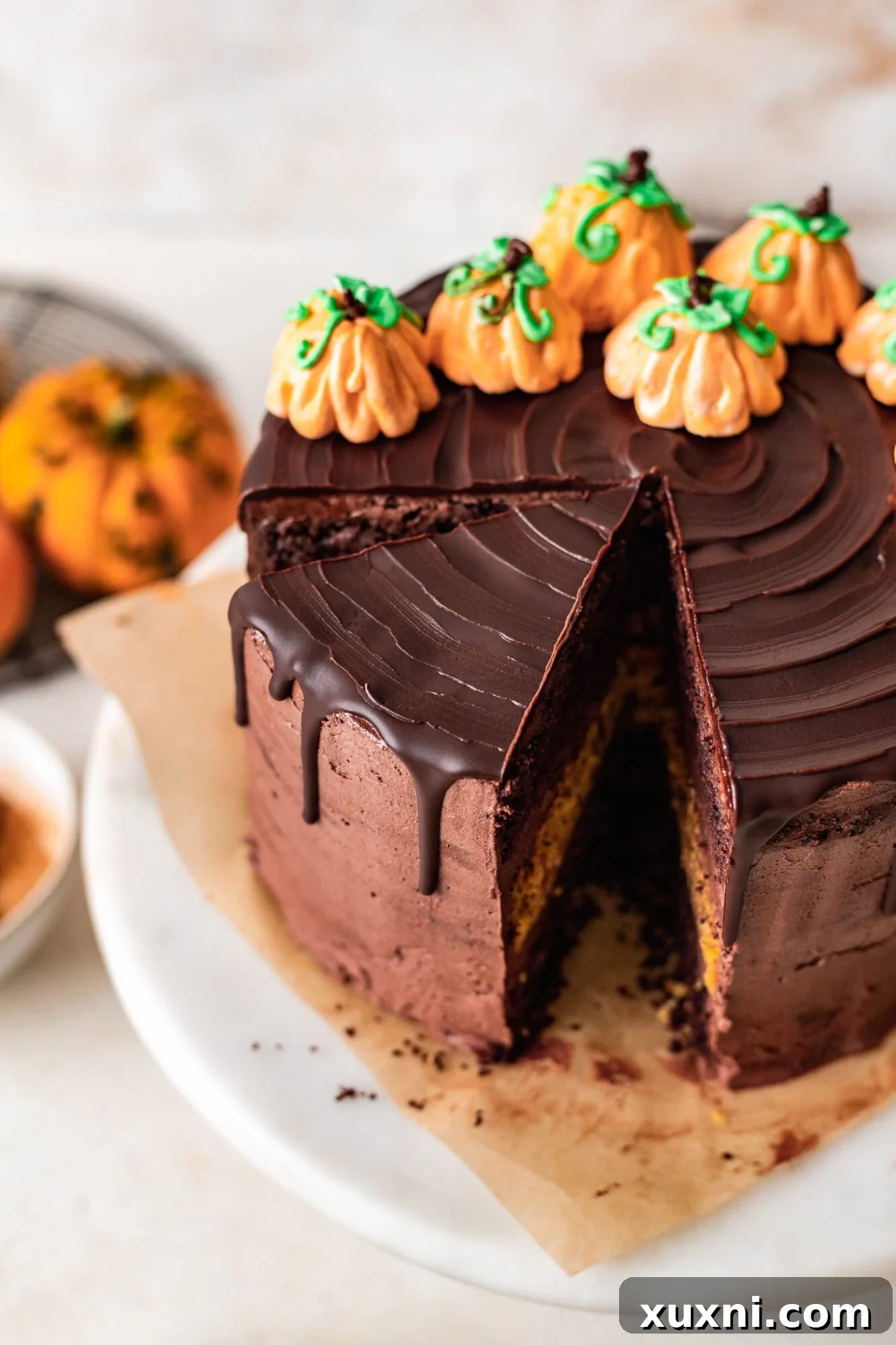 Sliced vegan chocolate pumpkin cake revealing layers