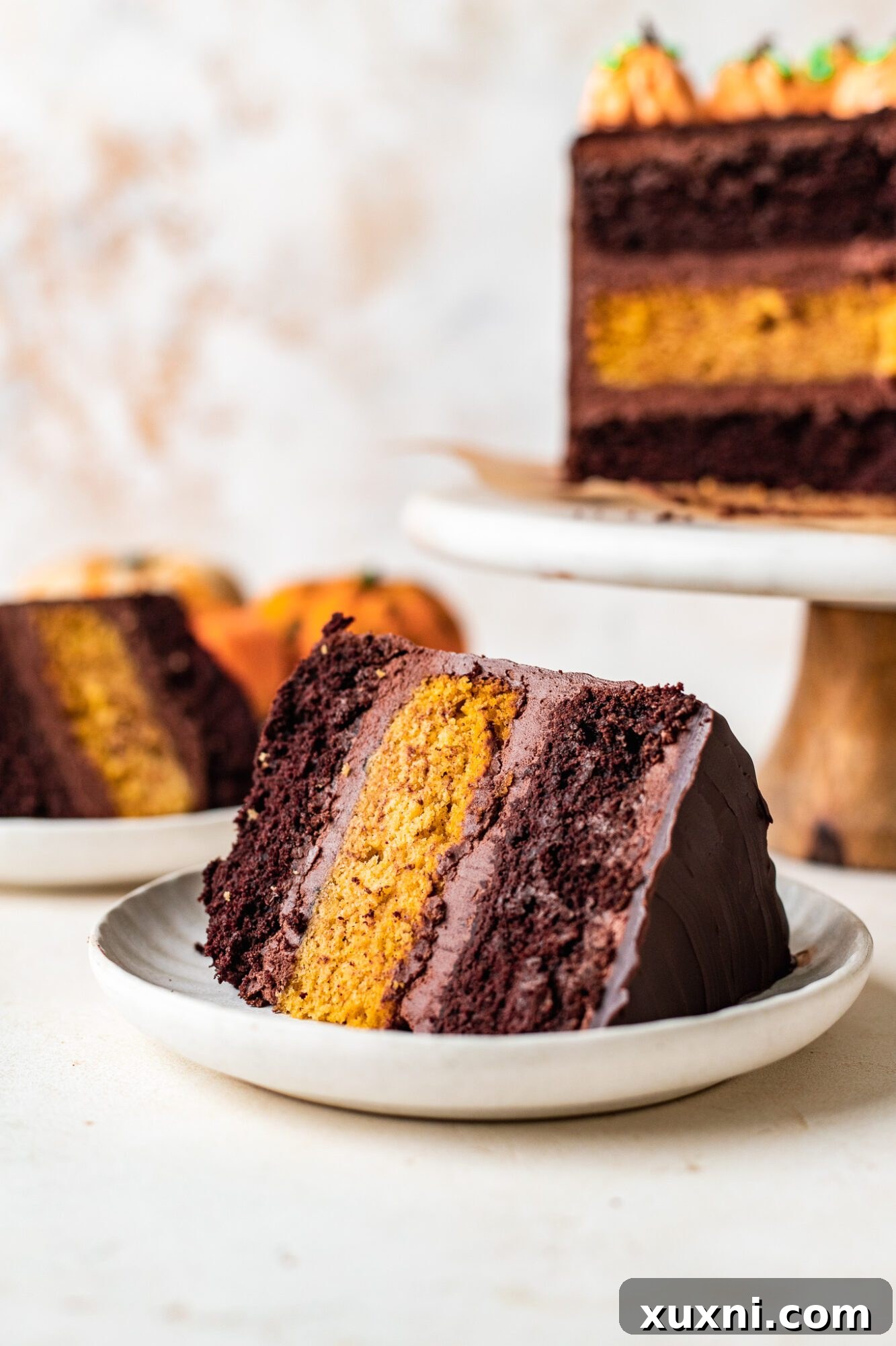 Close-up of a slice of pumpkin cake with decorative frosting