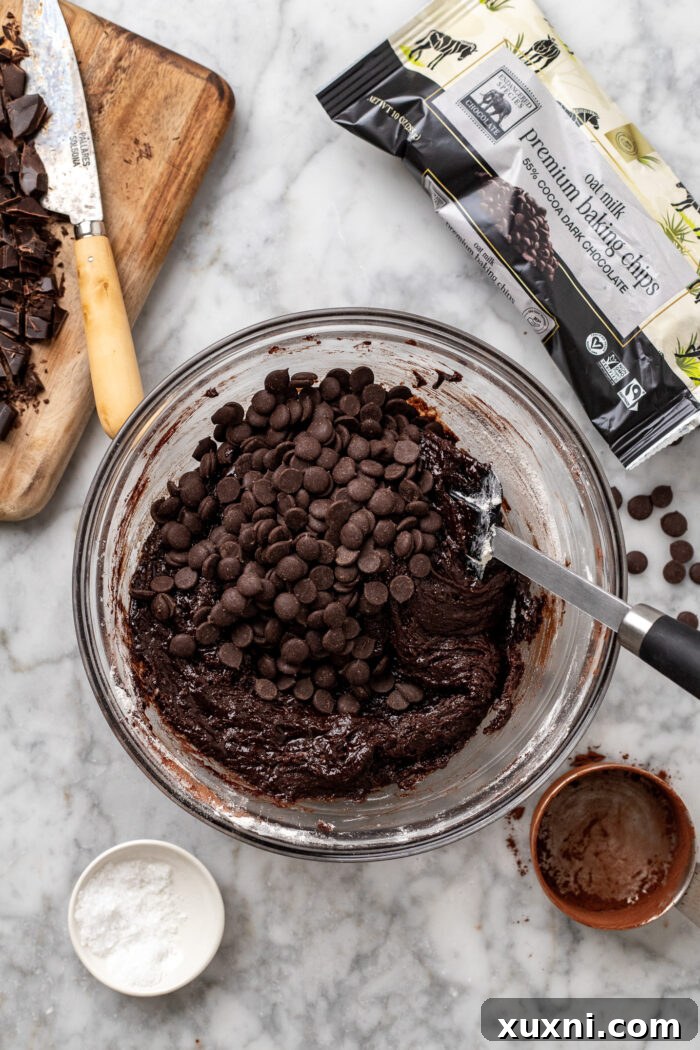 Preparing the cookie skillet, showing dough being pressed into the pan