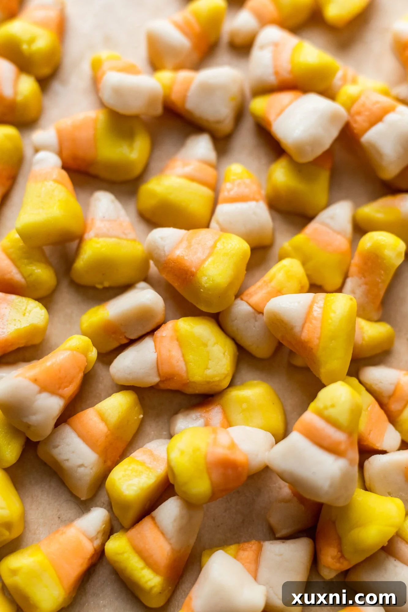 Easy steps to make homemade vegan candy corn dough, divided and ready for coloring.