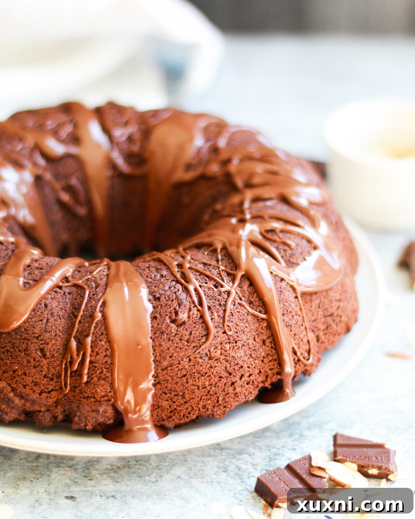 This healthy vegan chocolate bundt cake is a slice of chocolatey decadence on a plate! It's also completely gluten free and refined sugar free, and perfect for any age or occasion!