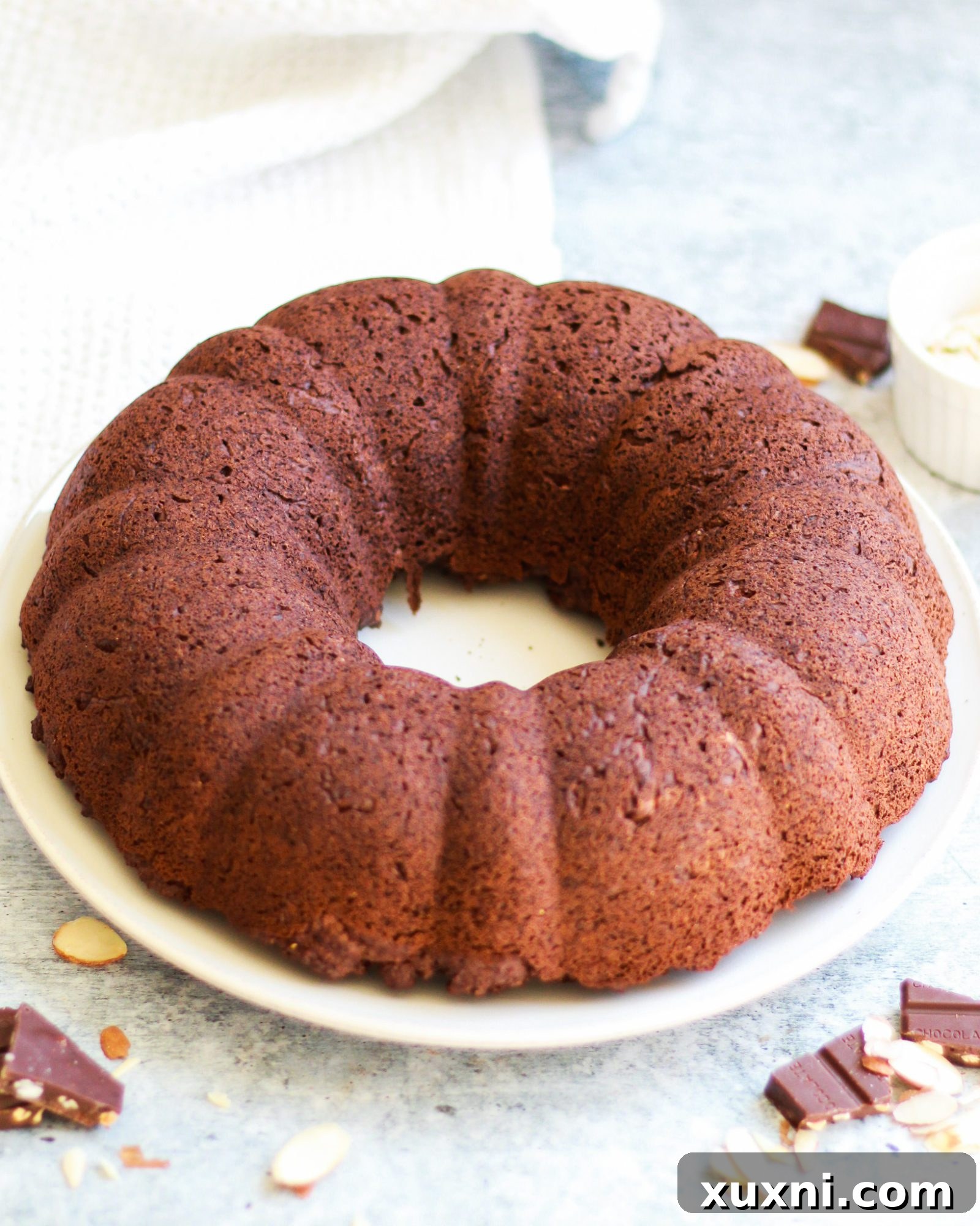 This healthy vegan chocolate bundt cake is a slice of chocolatey decadence on a plate! It's also completely gluten free and refined sugar free, and perfect for any age or occasion!