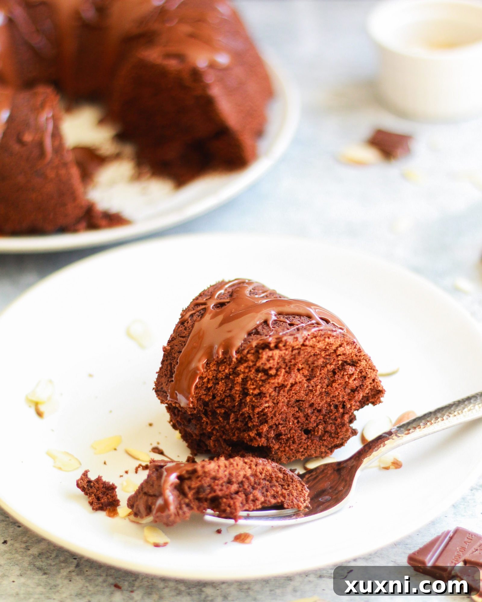 This healthy vegan chocolate bundt cake is a slice of chocolatey decadence on a plate! It's also completely gluten free and refined sugar free, and perfect for any age or occasion!