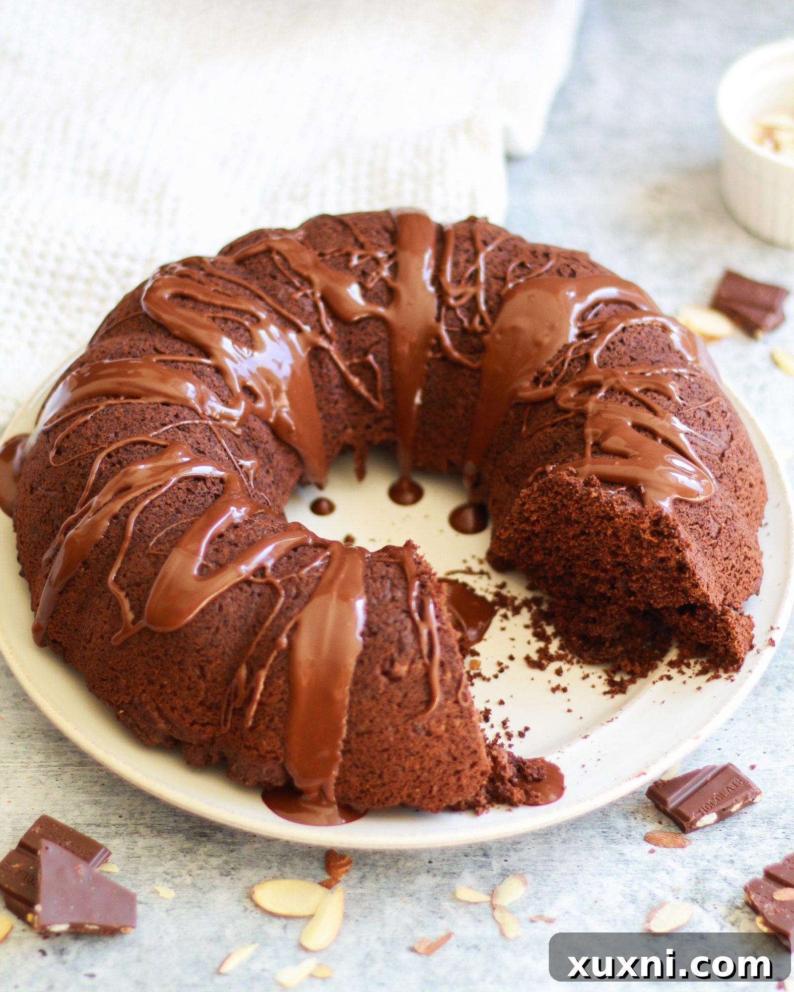 This healthy vegan chocolate bundt cake is a slice of chocolatey decadence on a plate! It's also completely gluten free and refined sugar free, and perfect for any age or occasion!