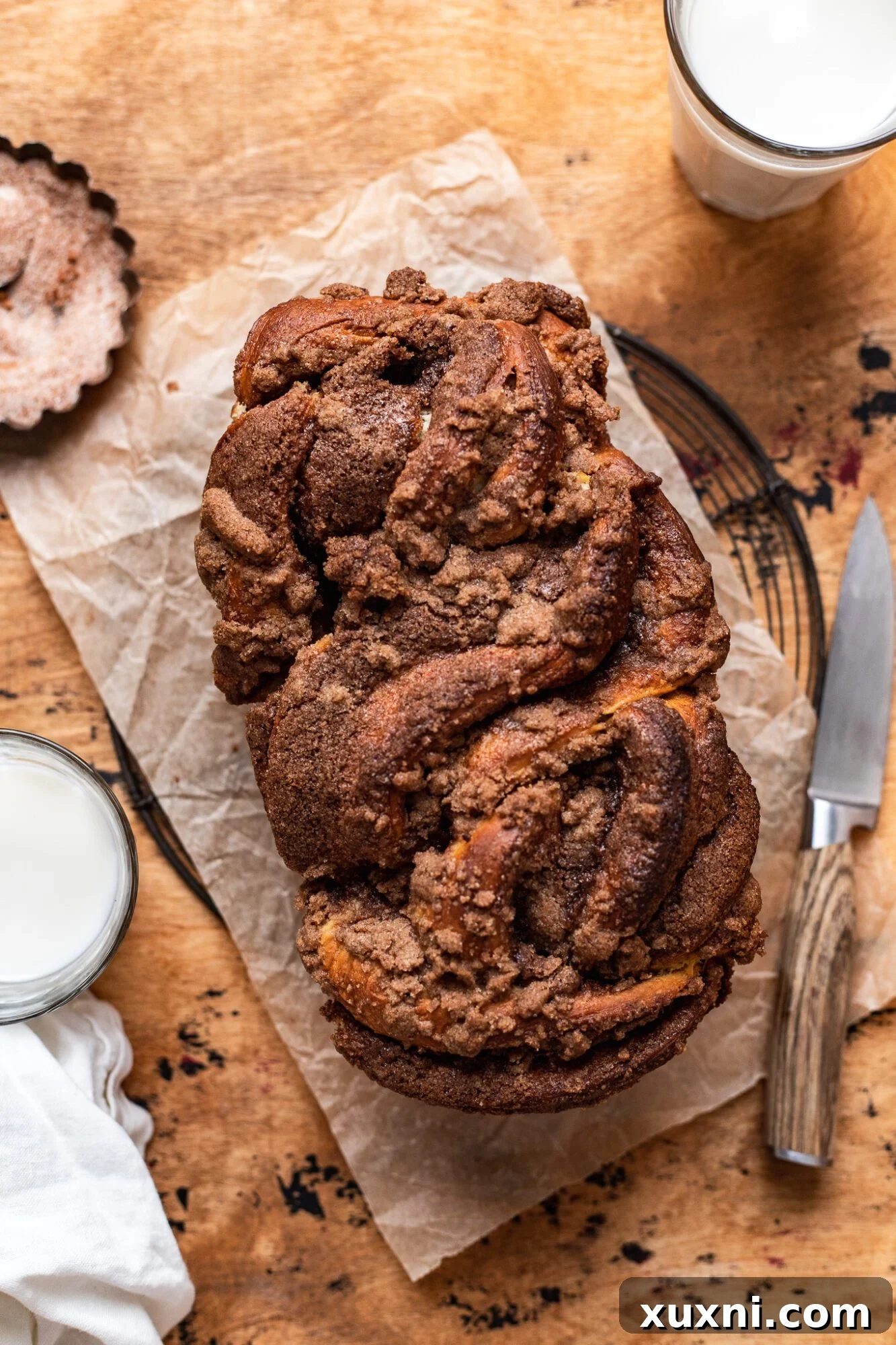 Pillowy Soft Cinnamon Vegan Babka Recipe 3 vegan cinnamon babka on parchment