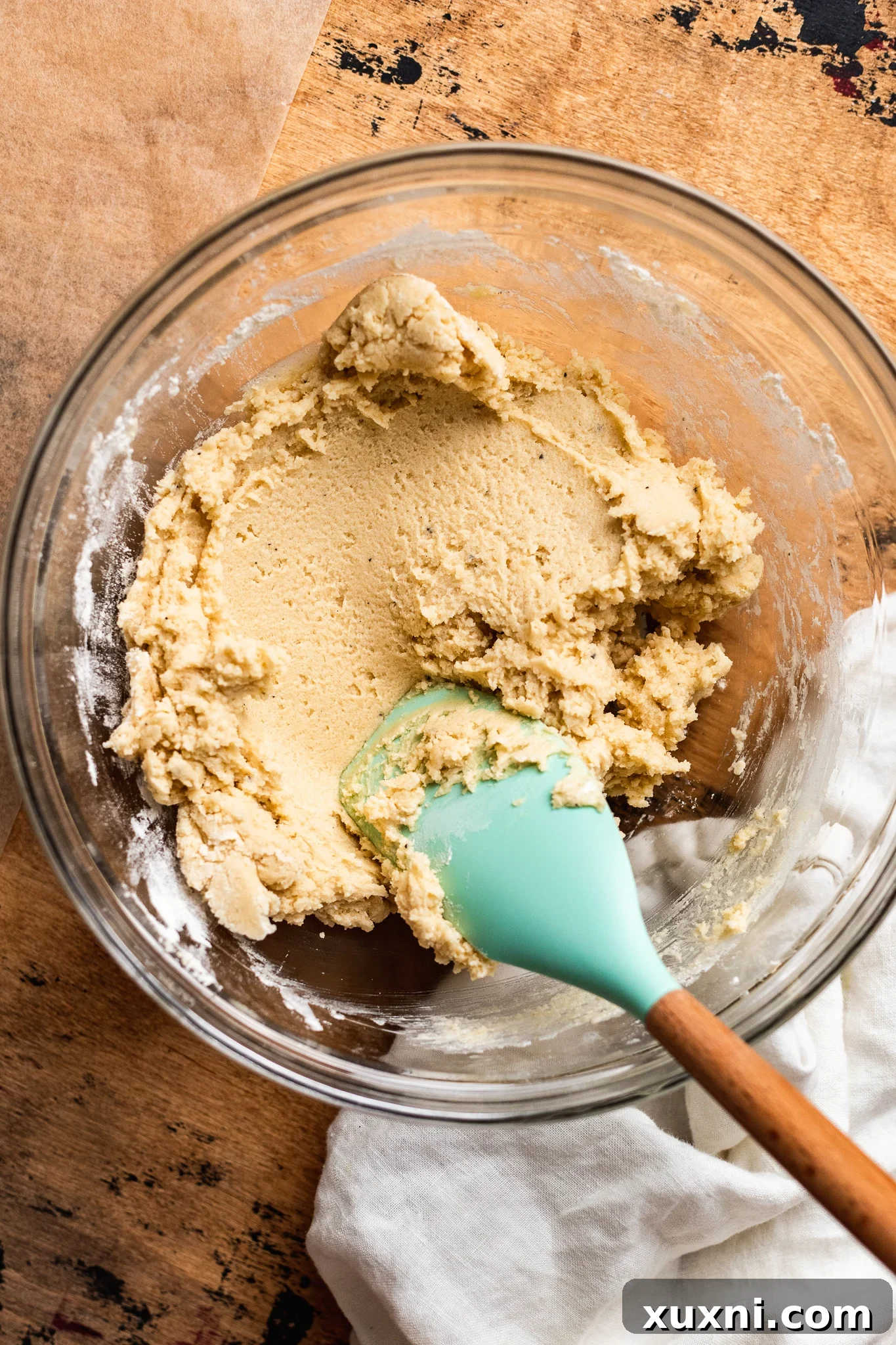 Mixing flour into vegan butter for shortbread cookie dough